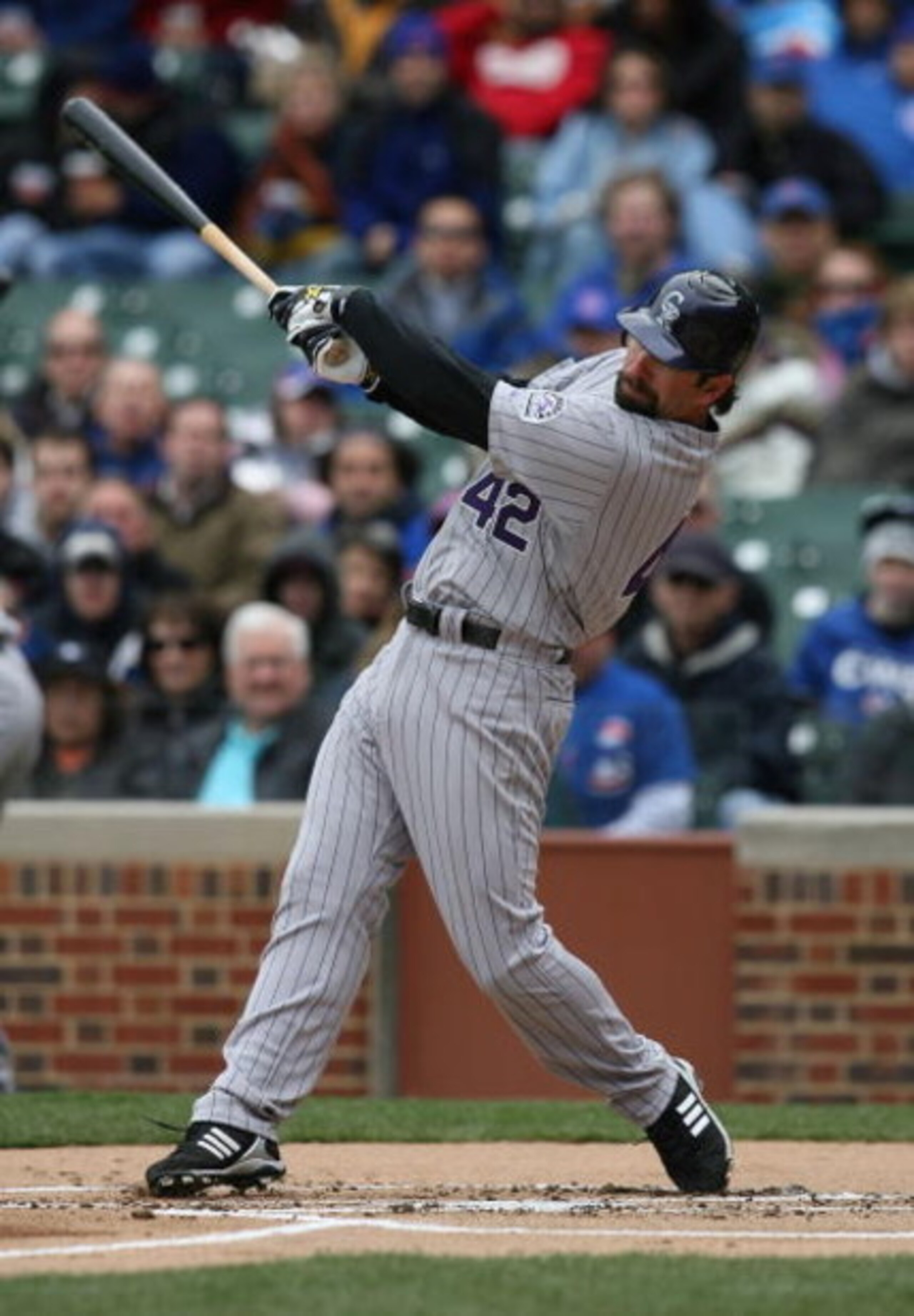 CHICAGO - APRIL 15: Todd Helton of the Colorado Rockies, wearing a #42 jersey on Jackie Robinson Day, swings the bat against the Chicago Cubs on April 15, 2009 at Wrigley Field in Chicago, Illinois. The Rockies defeated the Cubs 5-2. (Photo by Jonathan Da CHICAGO - APRIL 15: Todd Helton of the Colorado Rockies, wearing a #42 jersey on Jackie Robinson Day, swings the bat against the Chicago Cubs on April 15, 2009 at Wrigley Field in Chicago, Illinois. The Rockies defeated the Cubs 5-2. (Photo by Jonathan Da