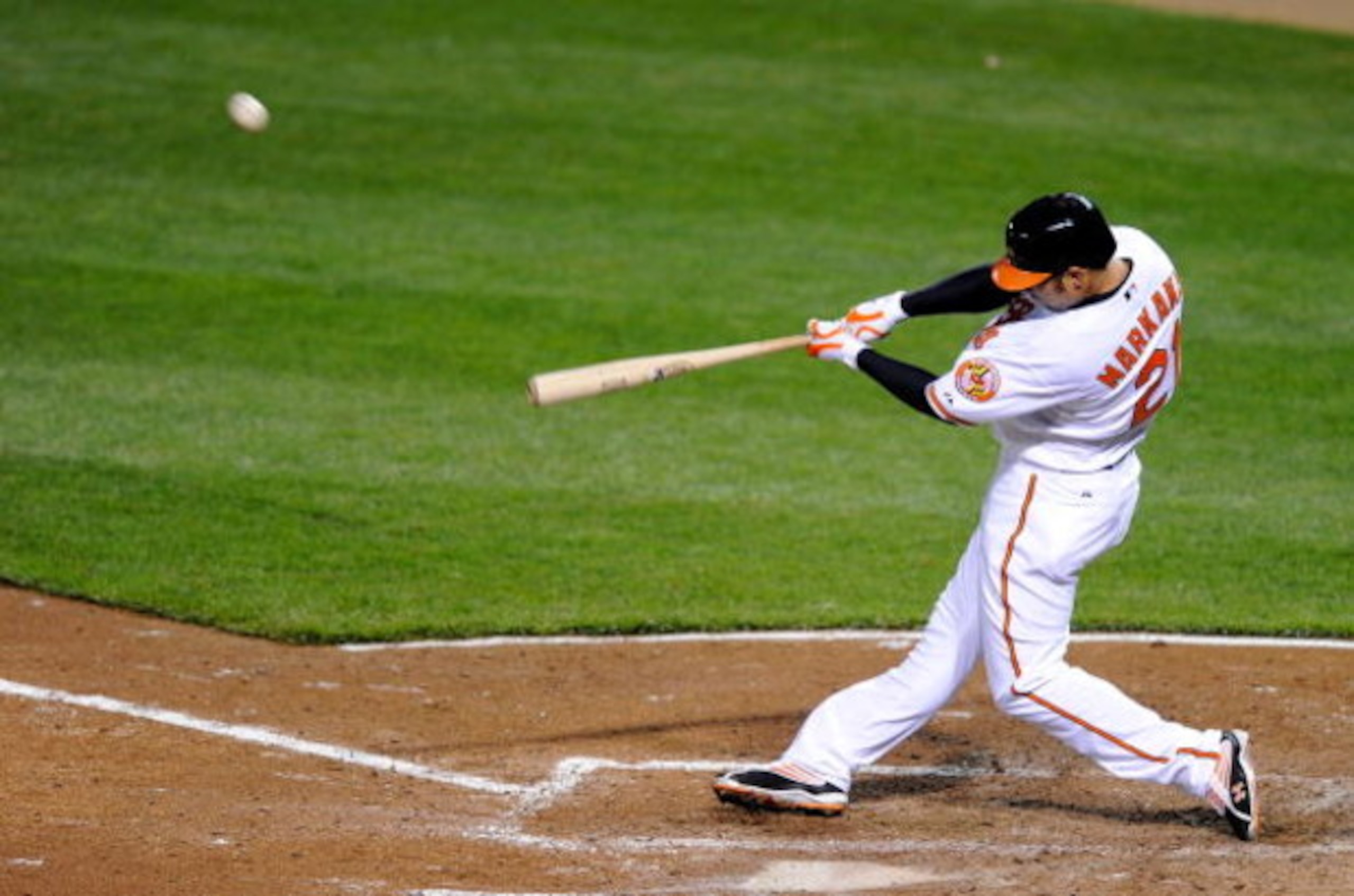BALTIMORE - APRIL 8: Nick Markakis #21 of the Baltimore Orioles hits a home run in the fourth inning against the New York Yankees at Camden Yards April 8, 2009 in Baltimore, Maryland. (Photo by Greg Fiume/Getty Images) BALTIMORE - APRIL 8: Nick Markakis #21 of the Baltimore Orioles hits a home run in the fourth inning against the New York Yankees at Camden Yards April 8, 2009 in Baltimore, Maryland. (Photo by Greg Fiume/Getty Images)