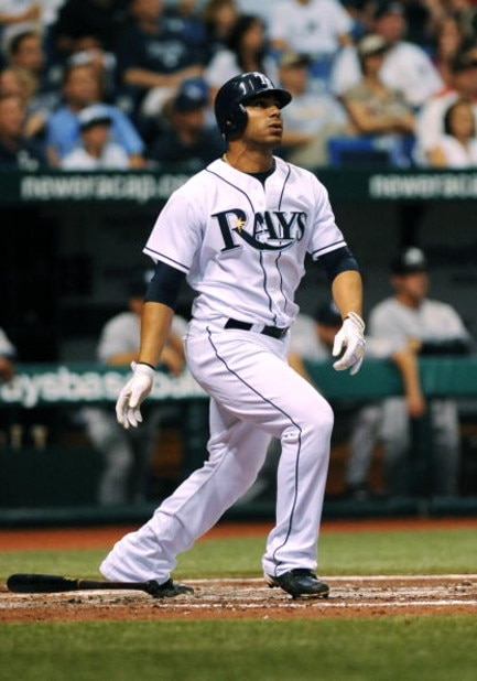 ST. PETERSBURG, FL - APRIL 15: Infielder Carlos Pena #23 of the Tampa Bay Rays homers against the New York Yankees at Tropicana Field on April 15, 2009 in St. Petersburg, Florida.  (Photo by Al Messerschmidt/Getty Images)