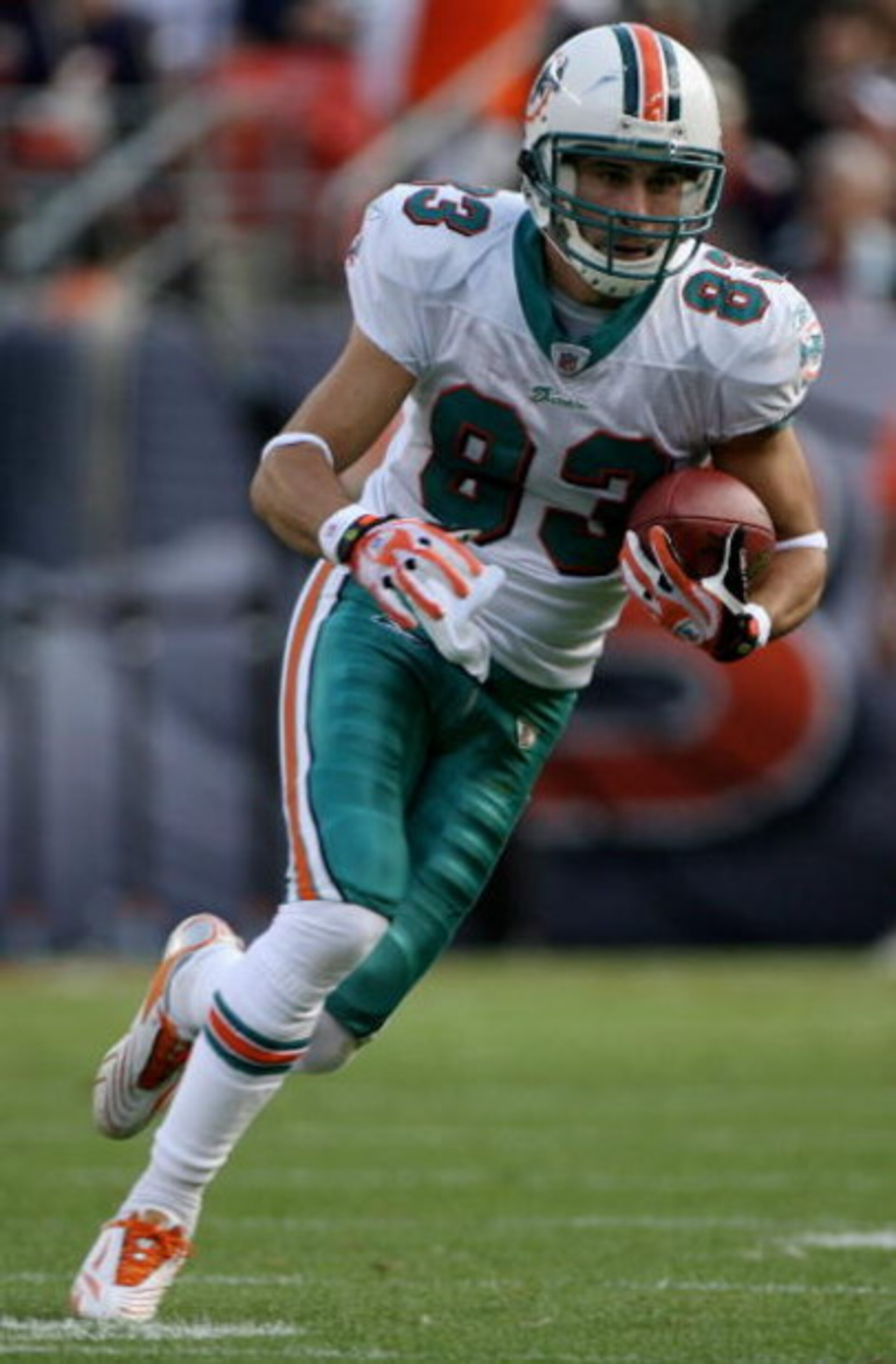 DENVER - NOVEMBER 02:  Wide receiver Greg Camarillo #83 of the Miami Dolphins makes a reception against the Denver Broncos during NFL action at Invesco Field at Mile High on November 2, 2008 in Denver, Colorado. The Dolphins defeated the Broncos 26-17.  (