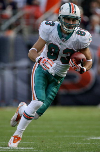 DENVER - NOVEMBER 02:  Wide receiver Greg Camarillo #83 of the Miami Dolphins makes a reception against the Denver Broncos during NFL action at Invesco Field at Mile High on November 2, 2008 in Denver, Colorado. The Dolphins defeated the Broncos 26-17.  (