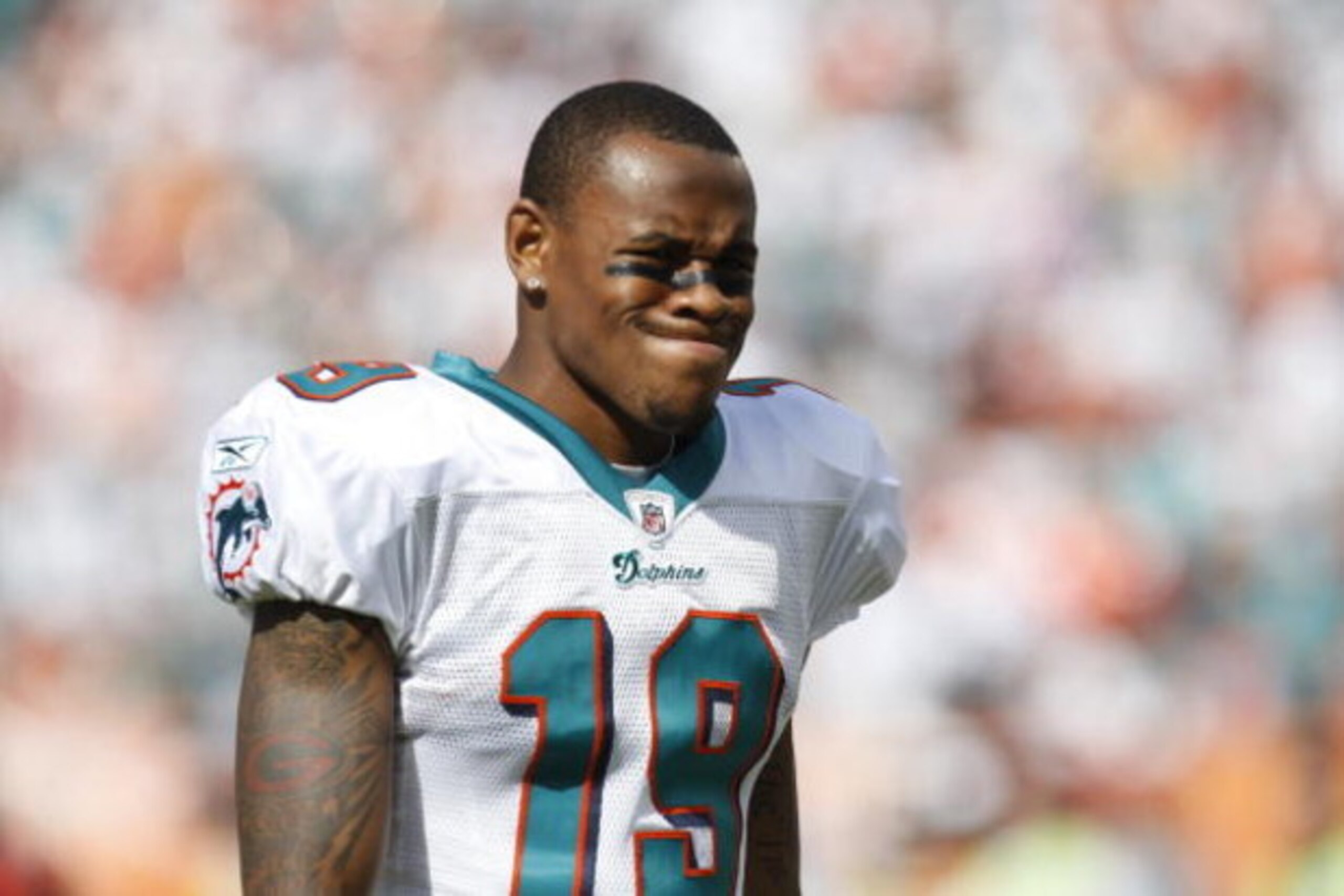 MIAMI - JANUARY 4:  Ted Ginn Jr. #19 of the Miami Dolphins looks on during a AFC Wild Card playoff game against the Baltimore Ravens on January 4, 2009 at Dolphin Stadium in Miami, Florida. (Photo by Gregory Shamus/Getty Images)