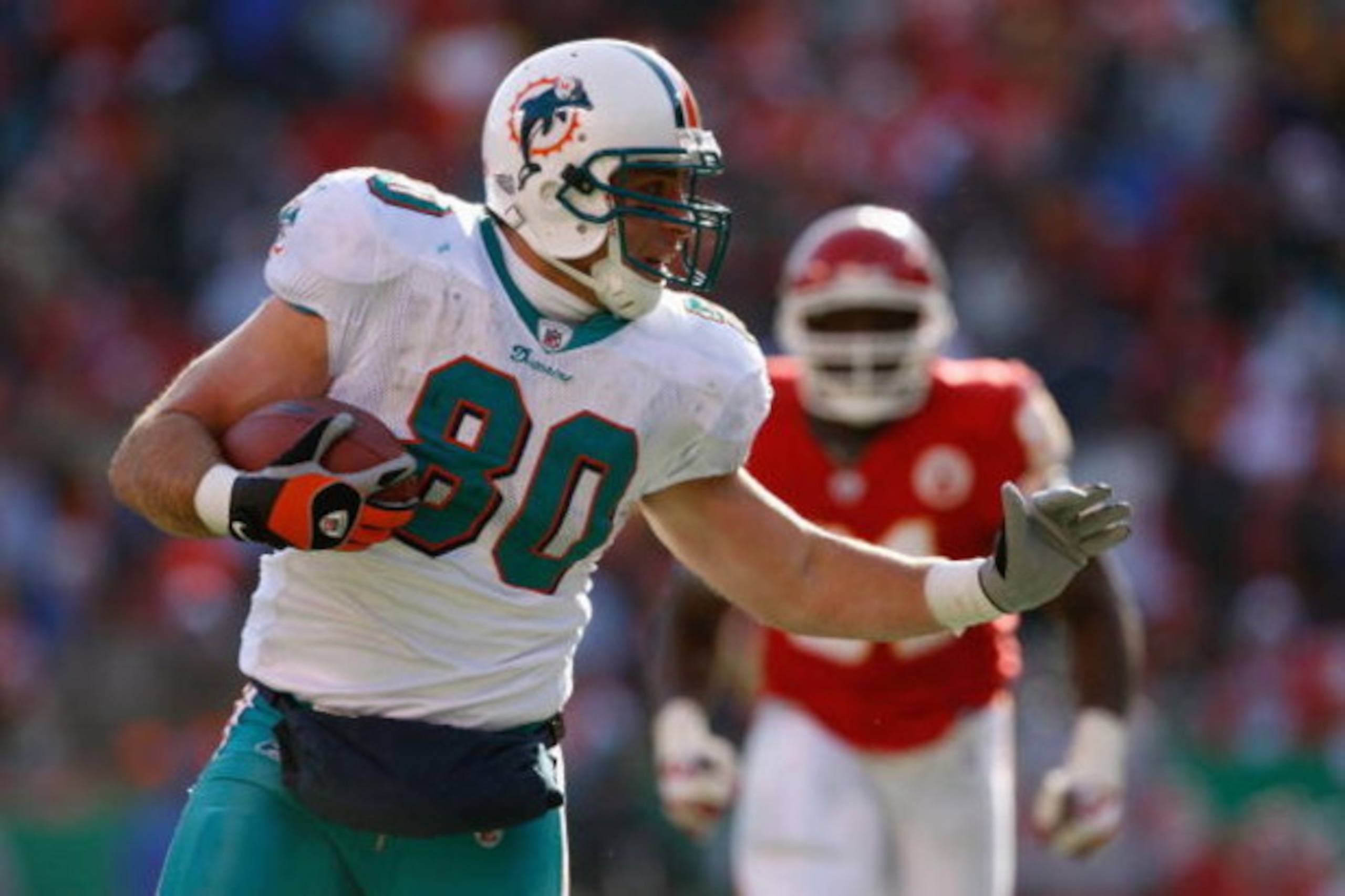 KANSAS CITY, MO - DECEMBER 21:  Anthony Fasano #80 of the Miami Dolphins carries the ball during the game against the Kansas City Chiefs on December 21, 2008 at Arrowhead Stadium in Kansas City, Missouri. (Photo by Jamie Squire/Getty Images)