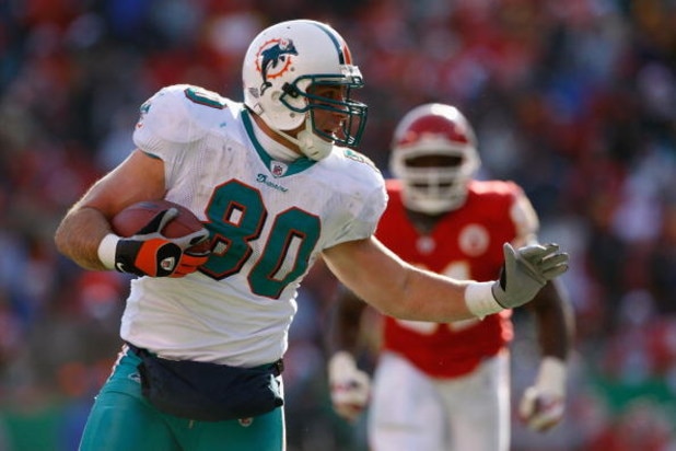 KANSAS CITY, MO - DECEMBER 21:  Anthony Fasano #80 of the Miami Dolphins carries the ball during the game against the Kansas City Chiefs on December 21, 2008 at Arrowhead Stadium in Kansas City, Missouri. (Photo by Jamie Squire/Getty Images)