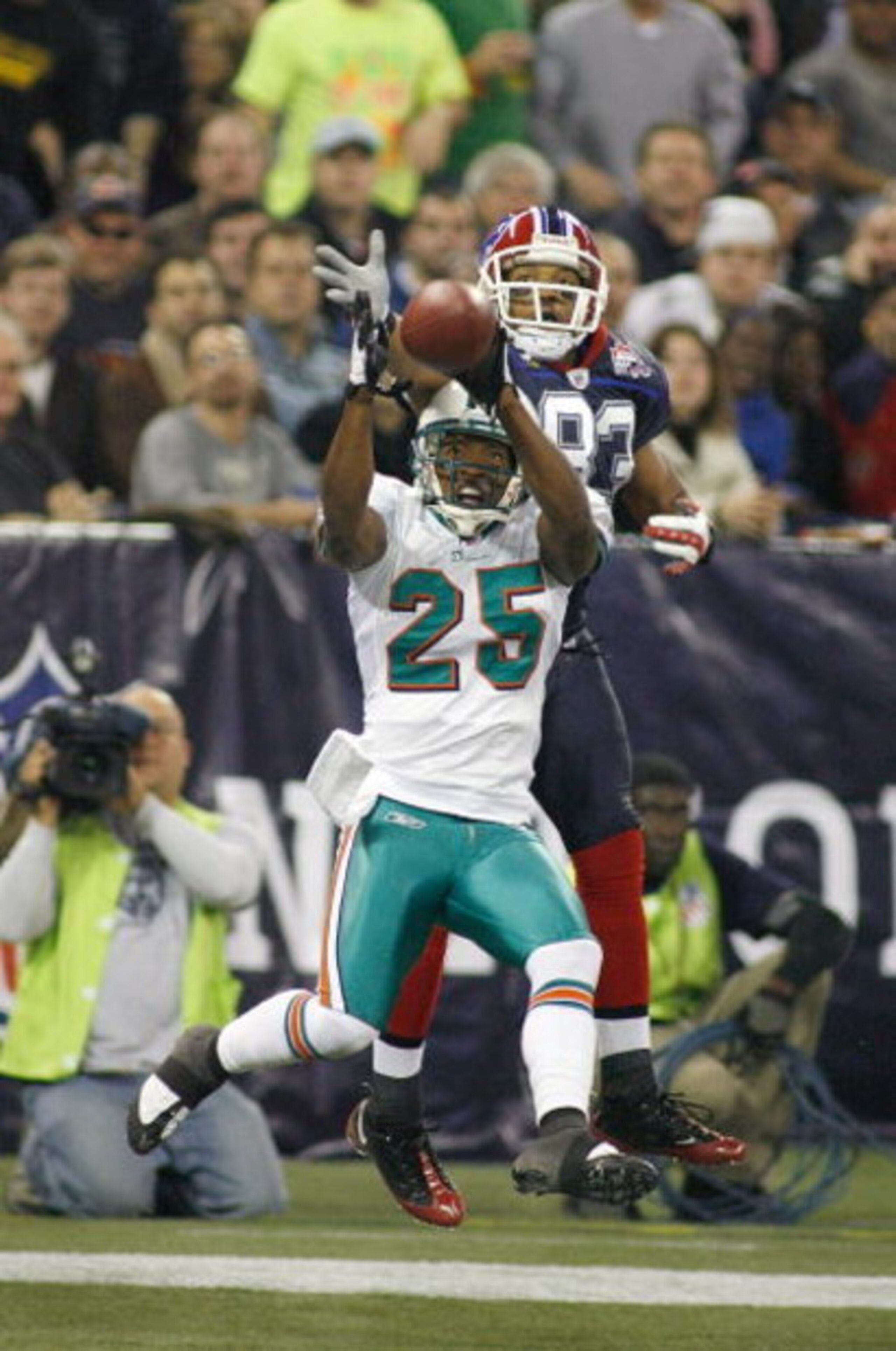 TORONTO, ON - DECEMBER 07: Will Allen #25 of the Miami Dolphins intercepts a pass in the end zone intended for Lee Evans #83 of the Buffalo Bills on December 7, 2008  at Rogers Centre in Toronto, Ontario, Canada. The Dolphins won 16-3.  (Photo by Rick Ste