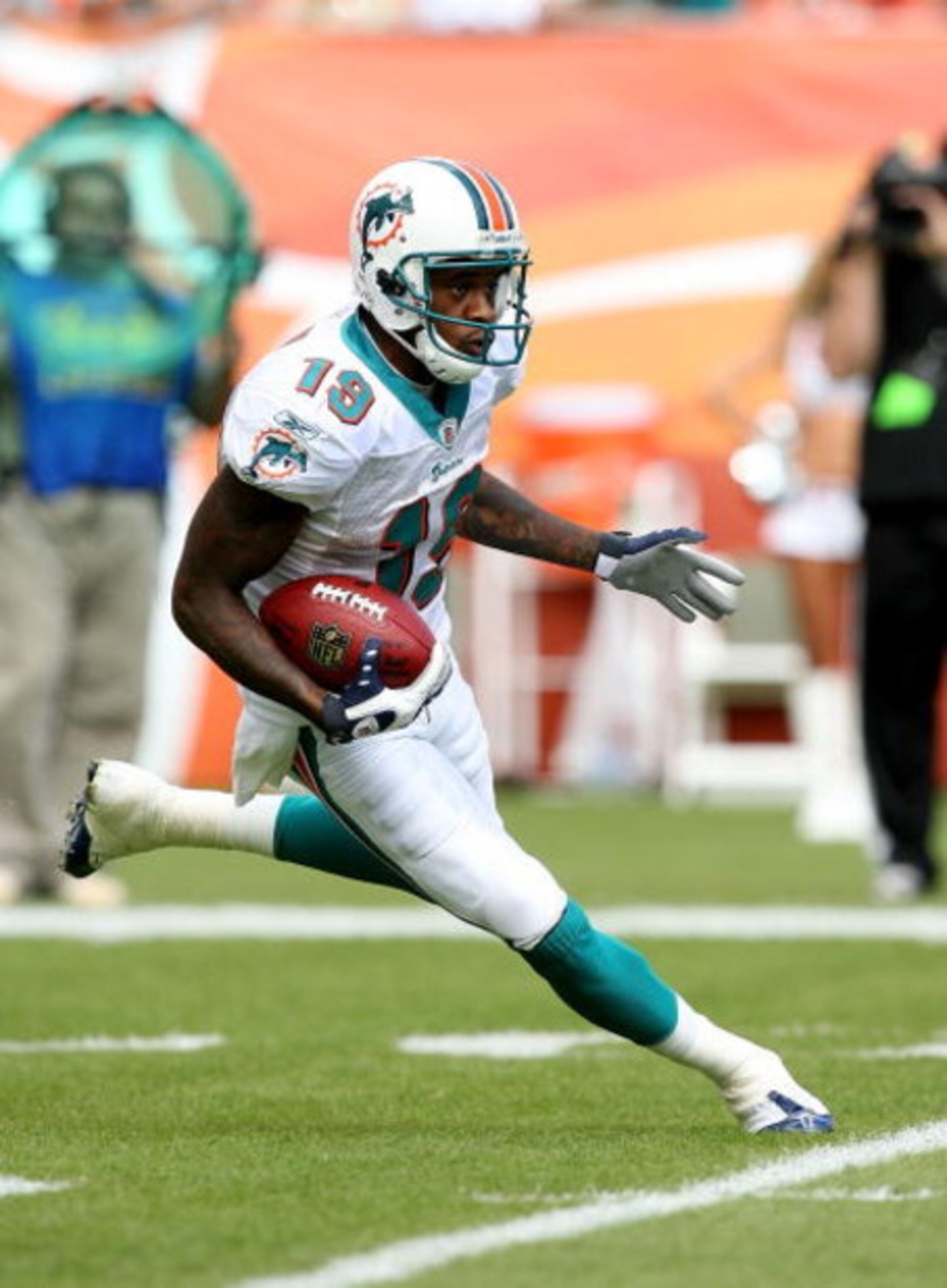 MIAMI - NOVEMBER 09:  Wide receiver Ted Ginn Jr. #19 of the Miami Dolphins look for room to run while taking on the Seattle Seahawks at Dolphin Stadium on November 9, 2008 in Miami, Florida. The Dolphins defeated the Seahawks 21-19.  (Photo by Doug Benc/G