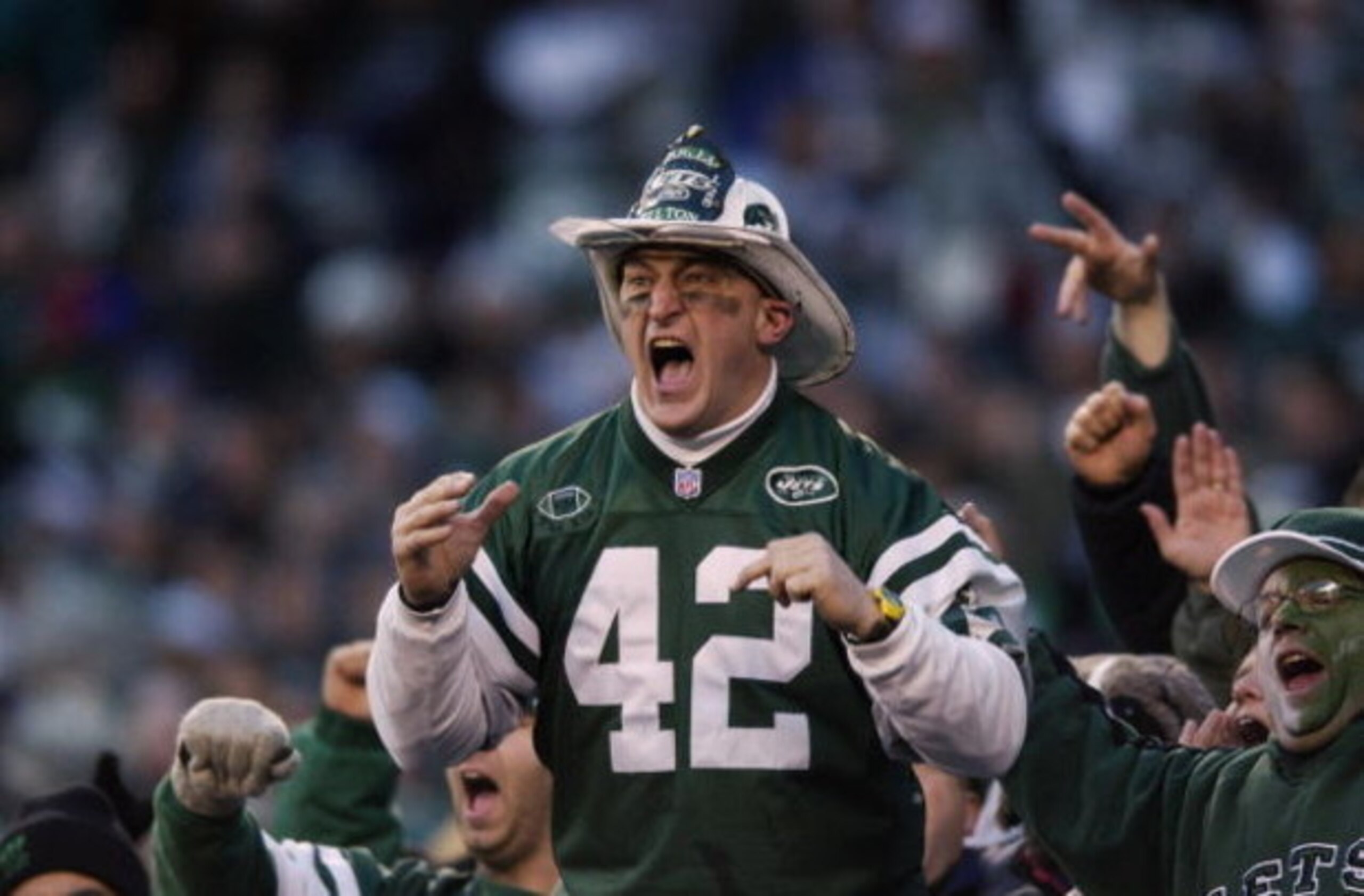 EAST RUTHERFORD, NJ - JANUARY 4: Fireman Eddie leads the J.E.T.S. cheer for the New York Jets against the Indianapolis Colts during the AFC Wildcard Game at Giant Stadium on January 4, 2003 in East Rutherford, New Jersey. The Jets won 41-0. (Photo by Ezr EAST RUTHERFORD, NJ - JANUARY 4: Fireman Eddie leads the J.E.T.S. cheer for the New York Jets against the Indianapolis Colts during the AFC Wildcard Game at Giant Stadium on January 4, 2003 in East Rutherford, New Jersey. The Jets won 41-0. (Photo by Ezr