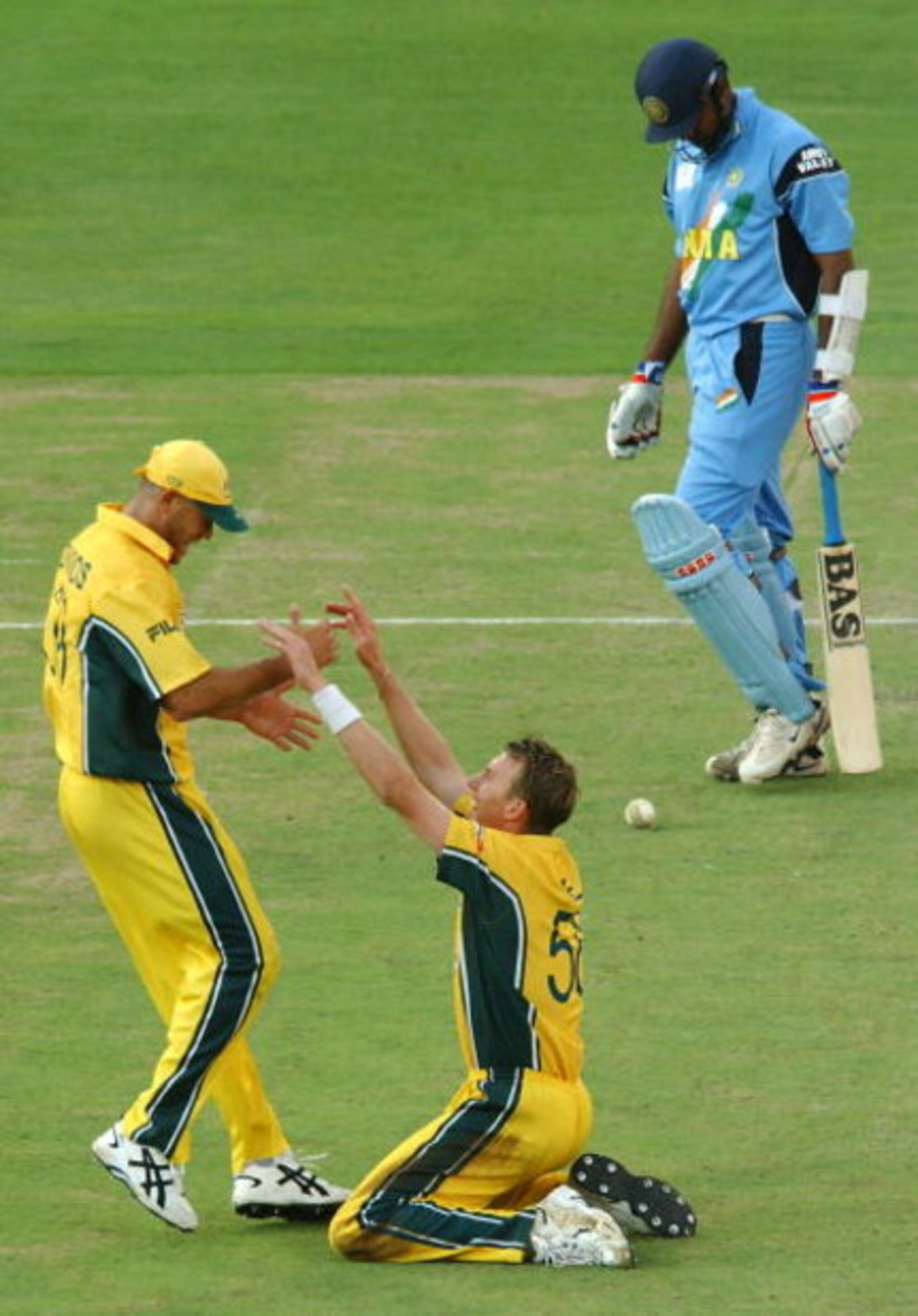 JOHANNESBURG - MARCH 23: Brett Lee of Australia celebrates a wicket with Andrew Symonds of Australia during the ICC Cricket World Cup Final between Australia and India held on March 23, 2003 at The Wanderers in Johannesburg, South Africa. Australia won JOHANNESBURG - MARCH 23: Brett Lee of Australia celebrates a wicket with Andrew Symonds of Australia during the ICC Cricket World Cup Final between Australia and India held on March 23, 2003 at The Wanderers in Johannesburg, South Africa. Australia won
