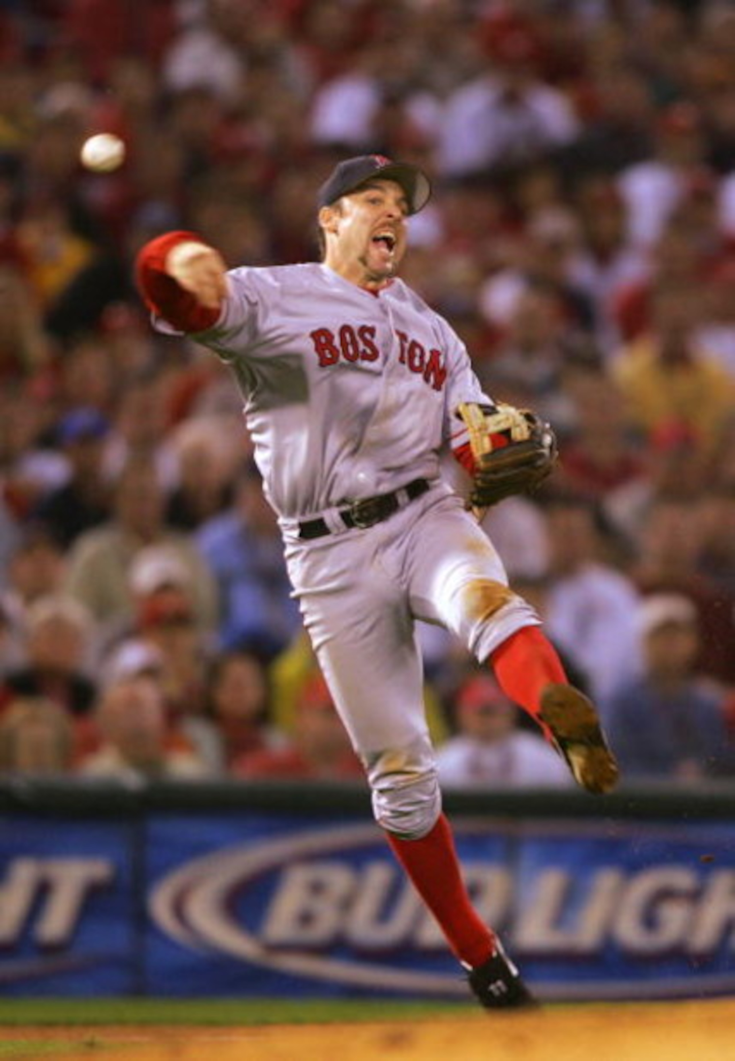 ST LOUIS - OCTOBER 26:  Third baseman Bill Mueller #11 of the Boston Red Sox throws out Scott Rolen #27 of the St. Louis Cardinals in the fourth inning during game three of the World Series on October 26, 2004 at Busch Stadium in St. Louis, Missouri. (Pho