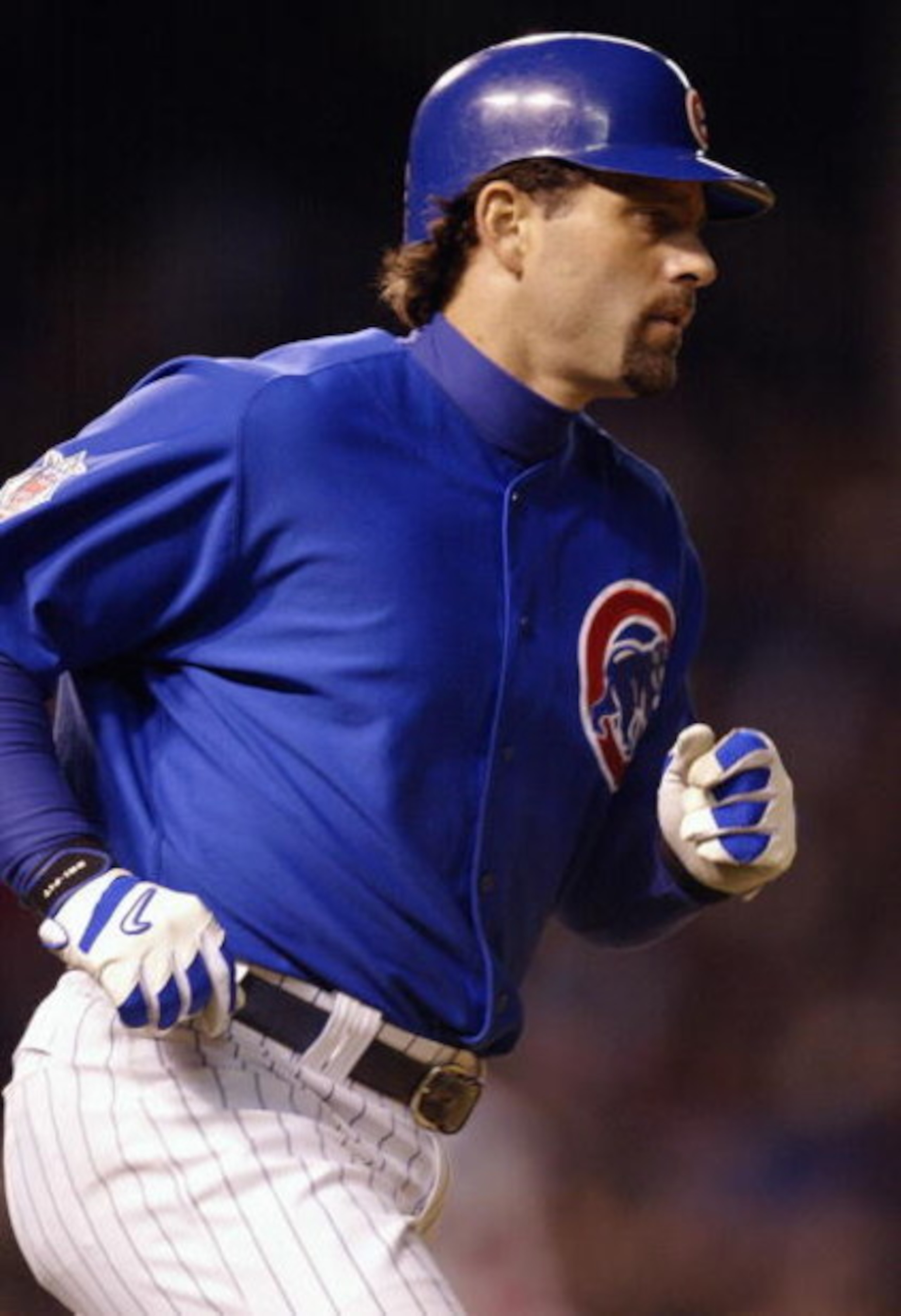CHICAGO - OCTOBER 4:  Eric Karros #32 of the Chicago Cubs runs the bases after hitting a home run to left field against the Atlanta Braves during game four of the National League Division Series on October 4, 2003 at Wrigley Field in Chicago, Illinois.  K