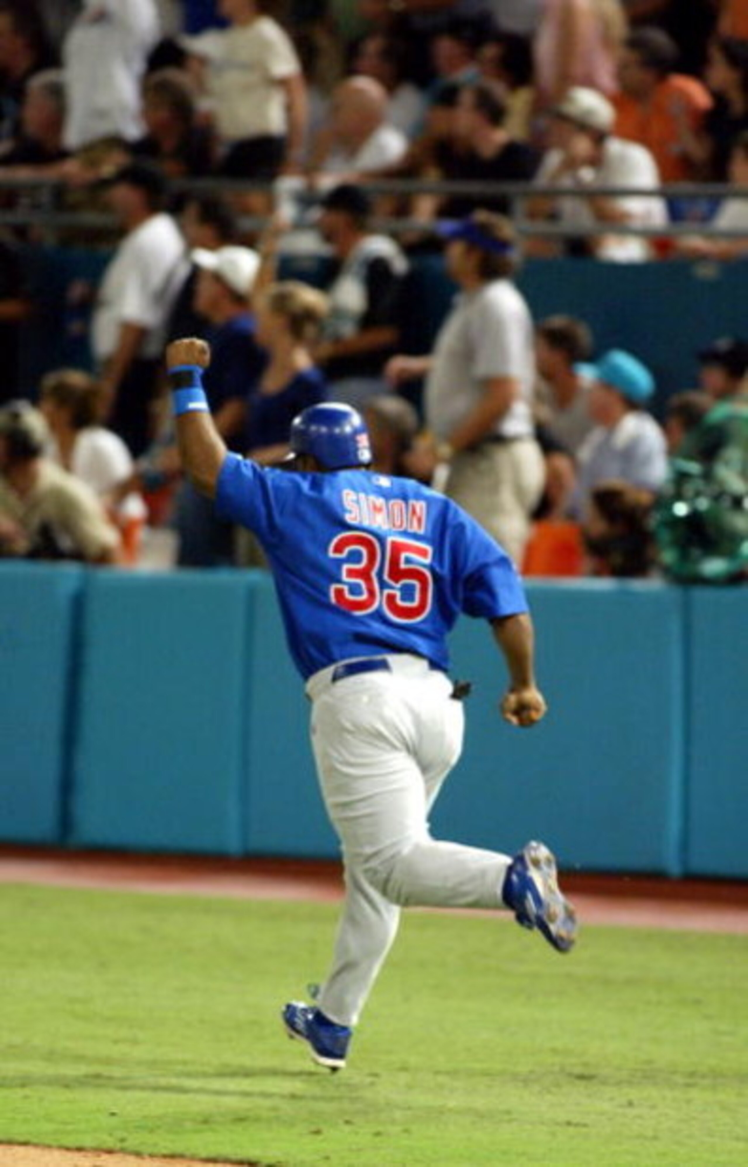 MIAMI - OCTOBER 10:  Randall Simon #35 of the Chicago Cubs celebrates his two run home run as he rounds the bases against the Florida Marlins in game three of the National League Championship Series on October 10, 2003 at Pro Player Stadium in Miami, Flor