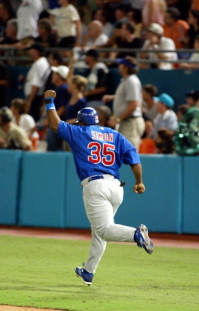 MIAMI - OCTOBER 10:  Randall Simon #35 of the Chicago Cubs celebrates his two run home run as he rounds the bases against the Florida Marlins in game three of the National League Championship Series on October 10, 2003 at Pro Player Stadium in Miami, Flor