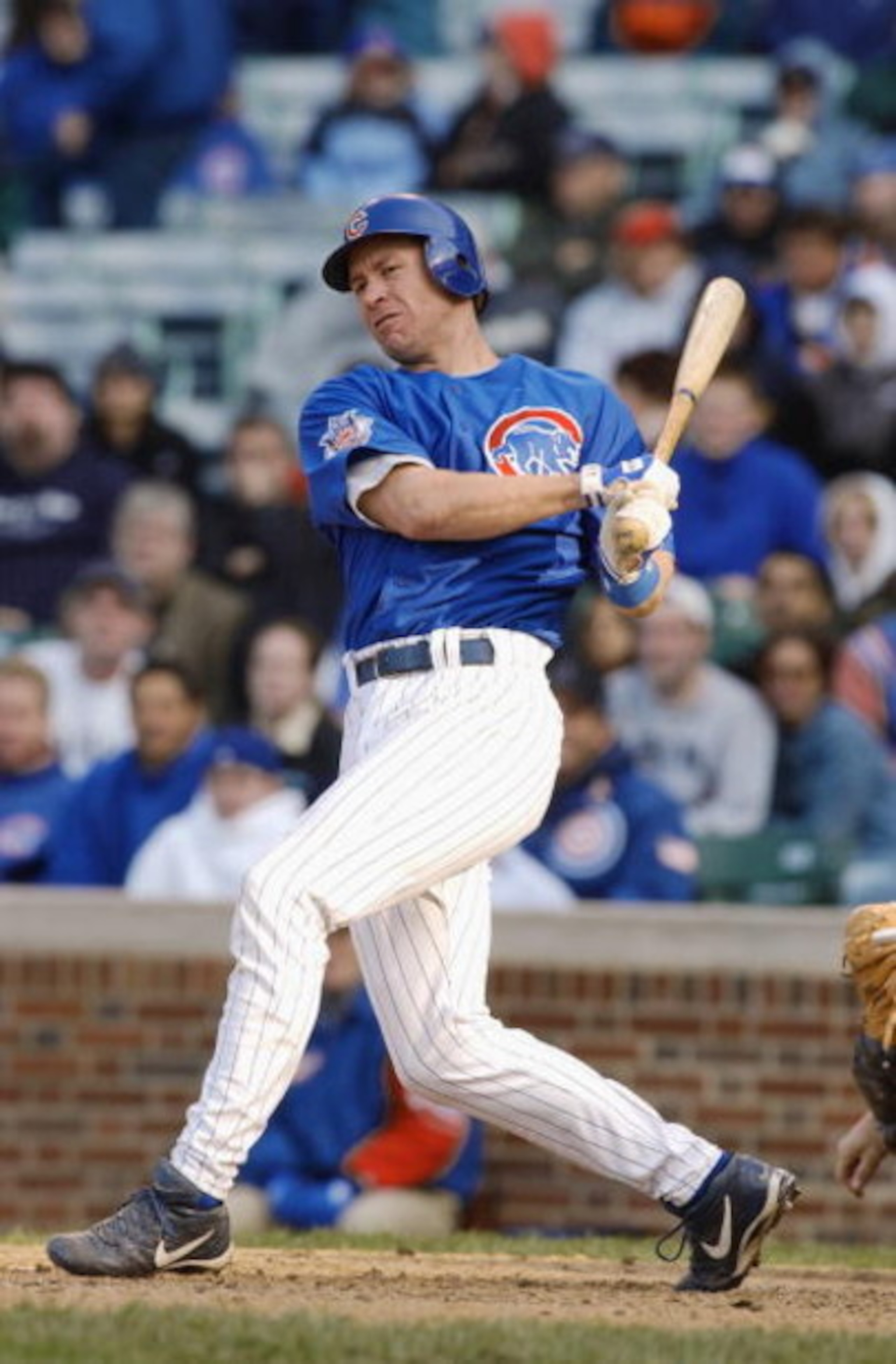 CHICAGO - MAY 31:  Catcher Damian Miller #27 of the Chicago Cubs swings at the pitch during the game against the Houston Astros at Wrigley Field on May 31, 2003 in Chicago, Illinois. The Cubs defeated the Astros 1-0 in 16 innings.  (Photo by Jonathan Dani