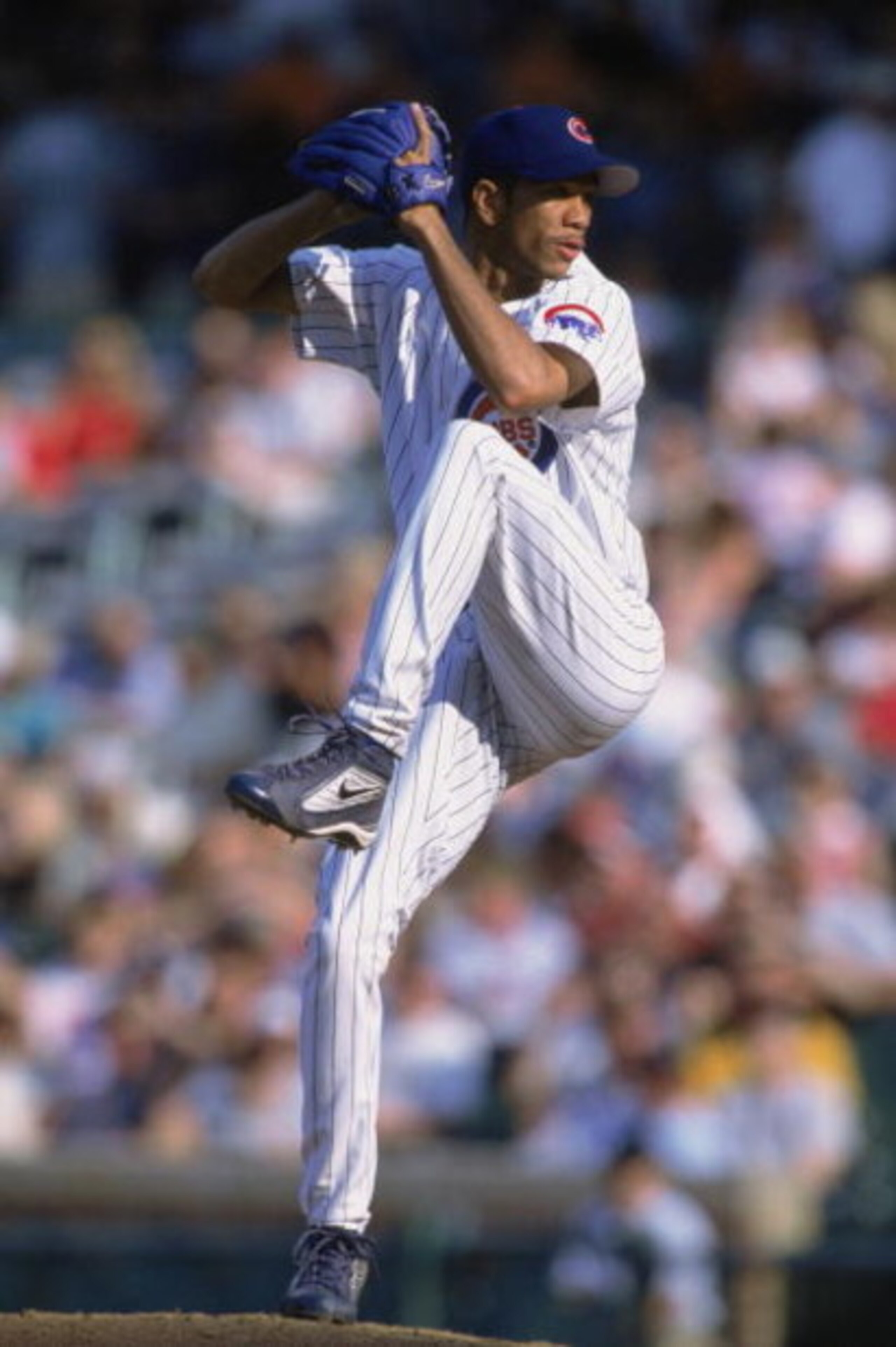 CHICAGO - AUGUST 30:  Juan Cruz #51 of the Chicago Cubs prepares to pitch the ball during their game against the St. Louis Cardinals at Wrigley Field in Chicago, Illinois on August 30th 2002. The Cardinals defeated the Cubs 6-3. (Photo by:  Jonathan Danie