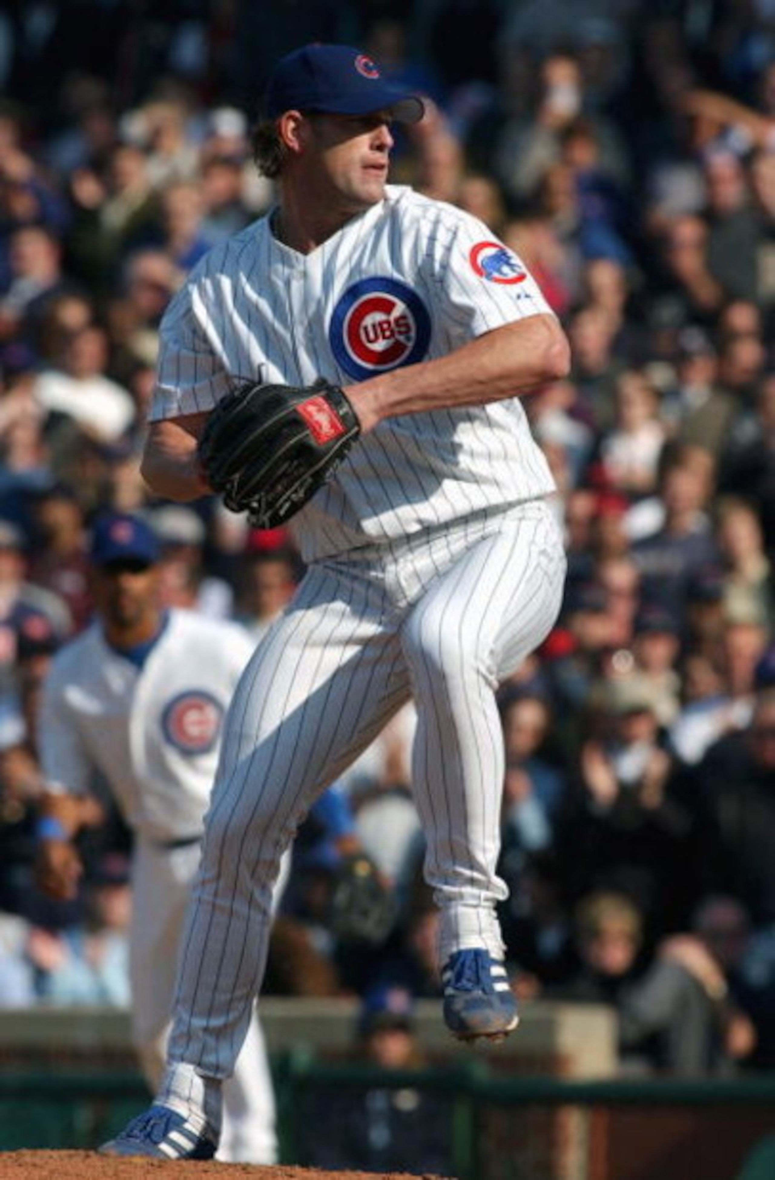 CHICAGO - APRIL 23:  Pitcher Kyle Farnsworth #44 of the Chicago Cubs delivers against the New York Mets during the game at Wrigley Field on April 23, 2004 in Chicago, Illinois.  The Cubs defeated the Mets 3-1.  (Photo by Jonathan Daniel/Getty Images)