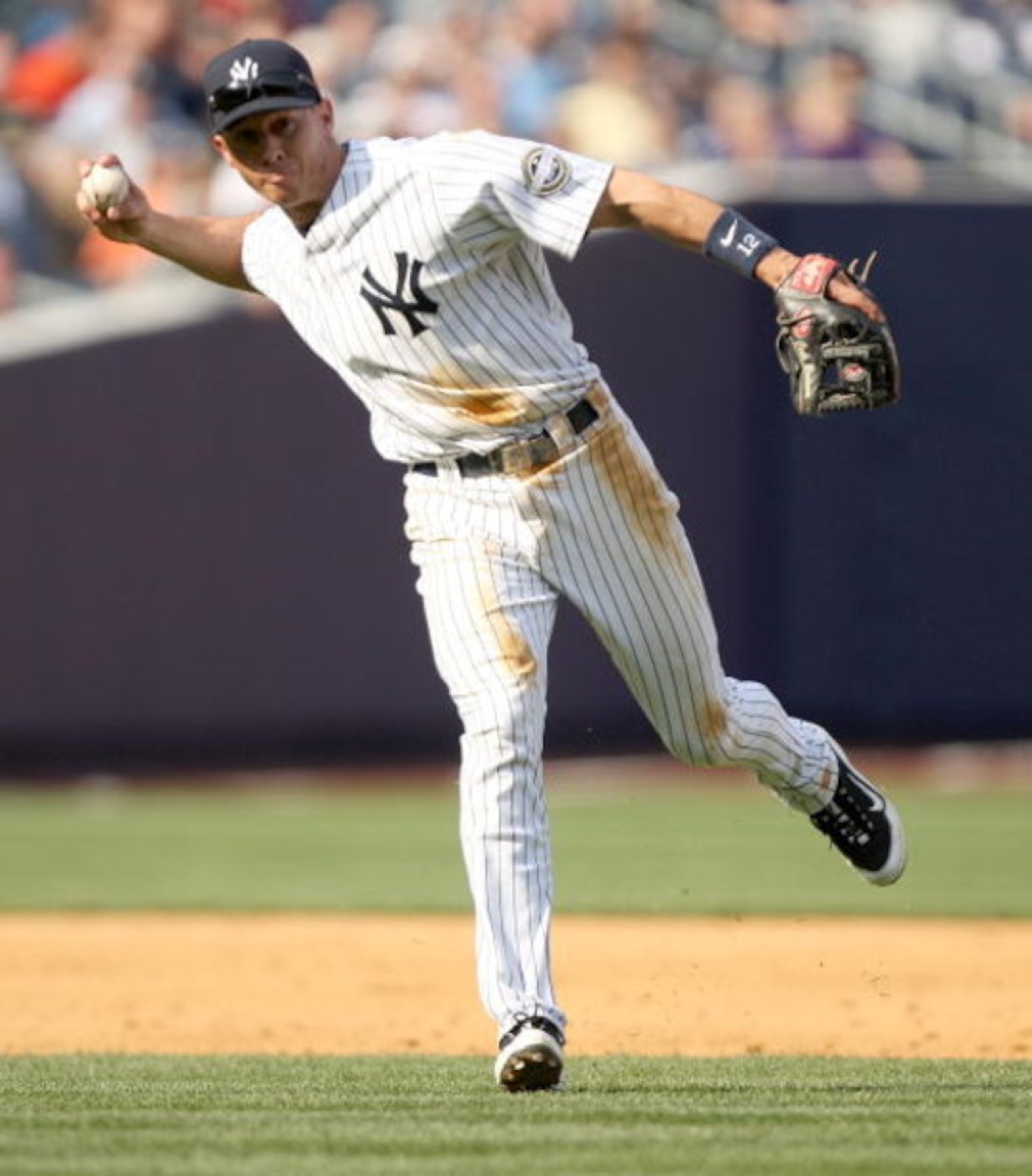 NEW YORK - APRIL 19:  Cody Ransom #12 of the New York Yankees fields a ball during their game against the Cleveland Indians at Yankee Stadium on April 19, 2009 in the Bronx borough of New York City.  (Photo by Ezra Shaw/Getty Images)