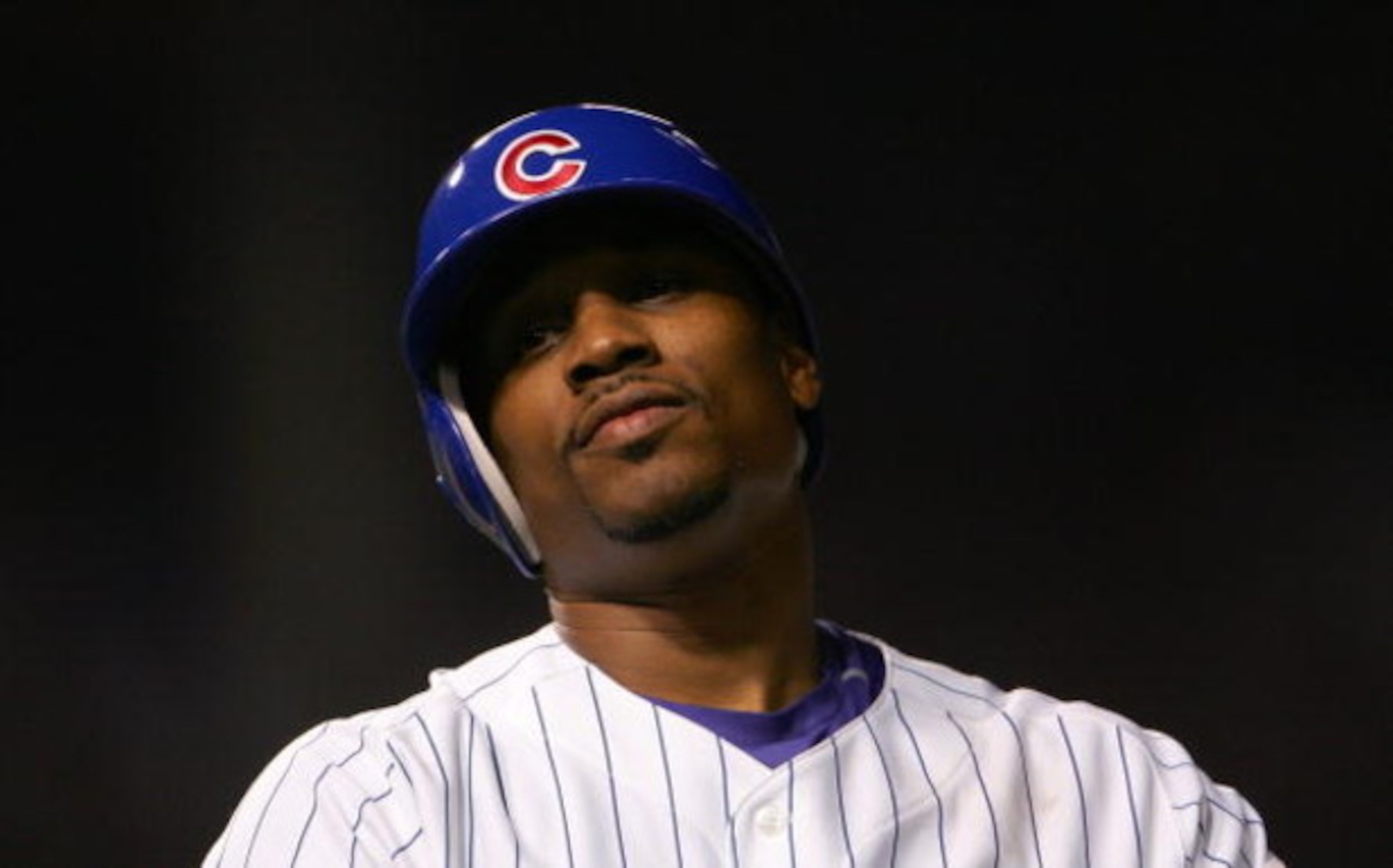 CHICAGO - OCTOBER 06:  Jacque Jones #11 of the Chicago Cubs reacts after he flied out for the last out in the bottom of the eighth inning against the Arizona Diamondbacks during Game Three of the National League Divisional Series at Wrigley Field on Octob