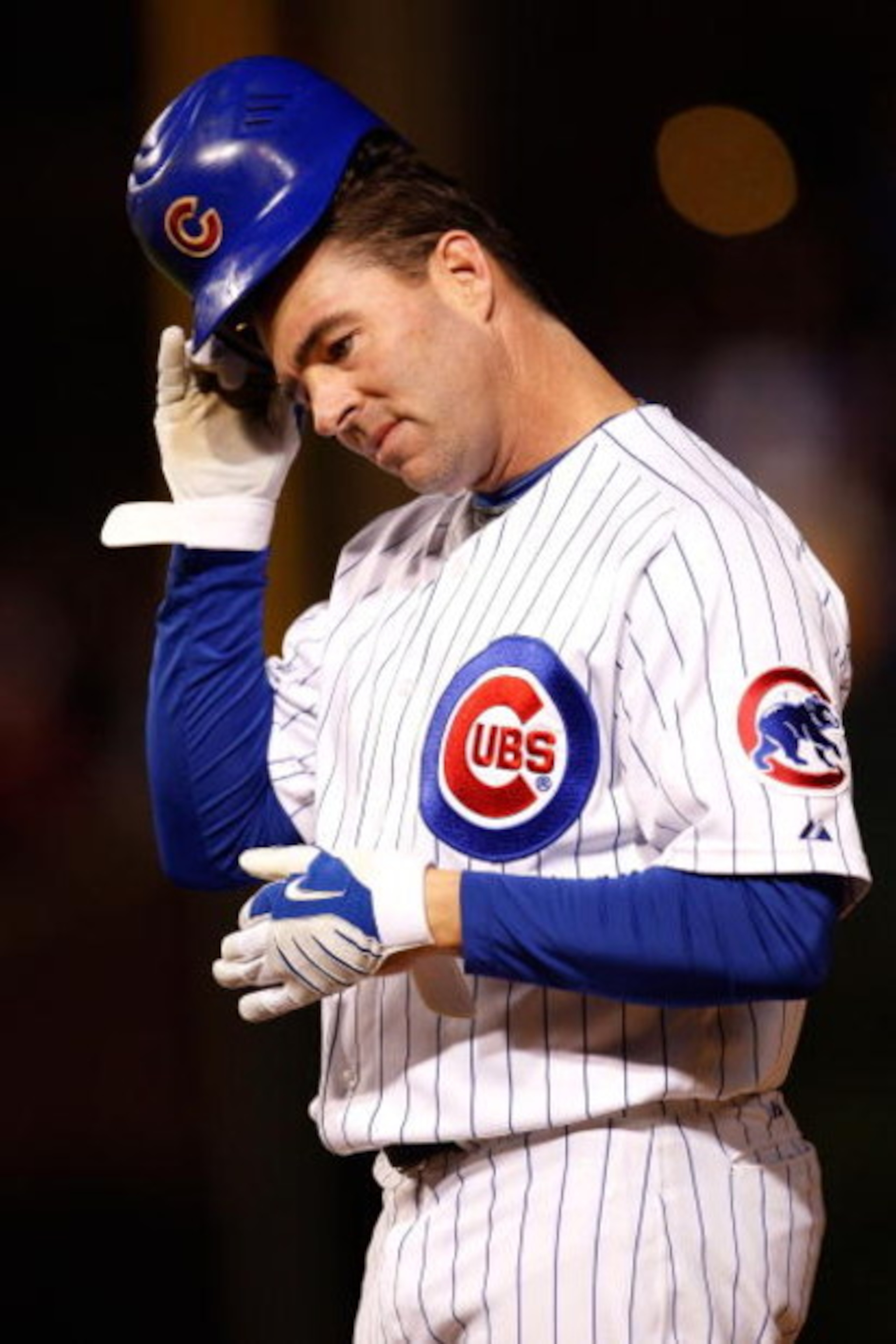 CHICAGO - OCTOBER 01:  Jim Edmonds #15 of the Chicago Cubs adjusts his helmet against the Los Angeles Dodgers in Game One of the NLDS during the 2008 MLB Playoffs at Wrigley Field on October 1, 2008 in Chicago, Illinois.  (Photo by Jamie Squire/Getty Imag