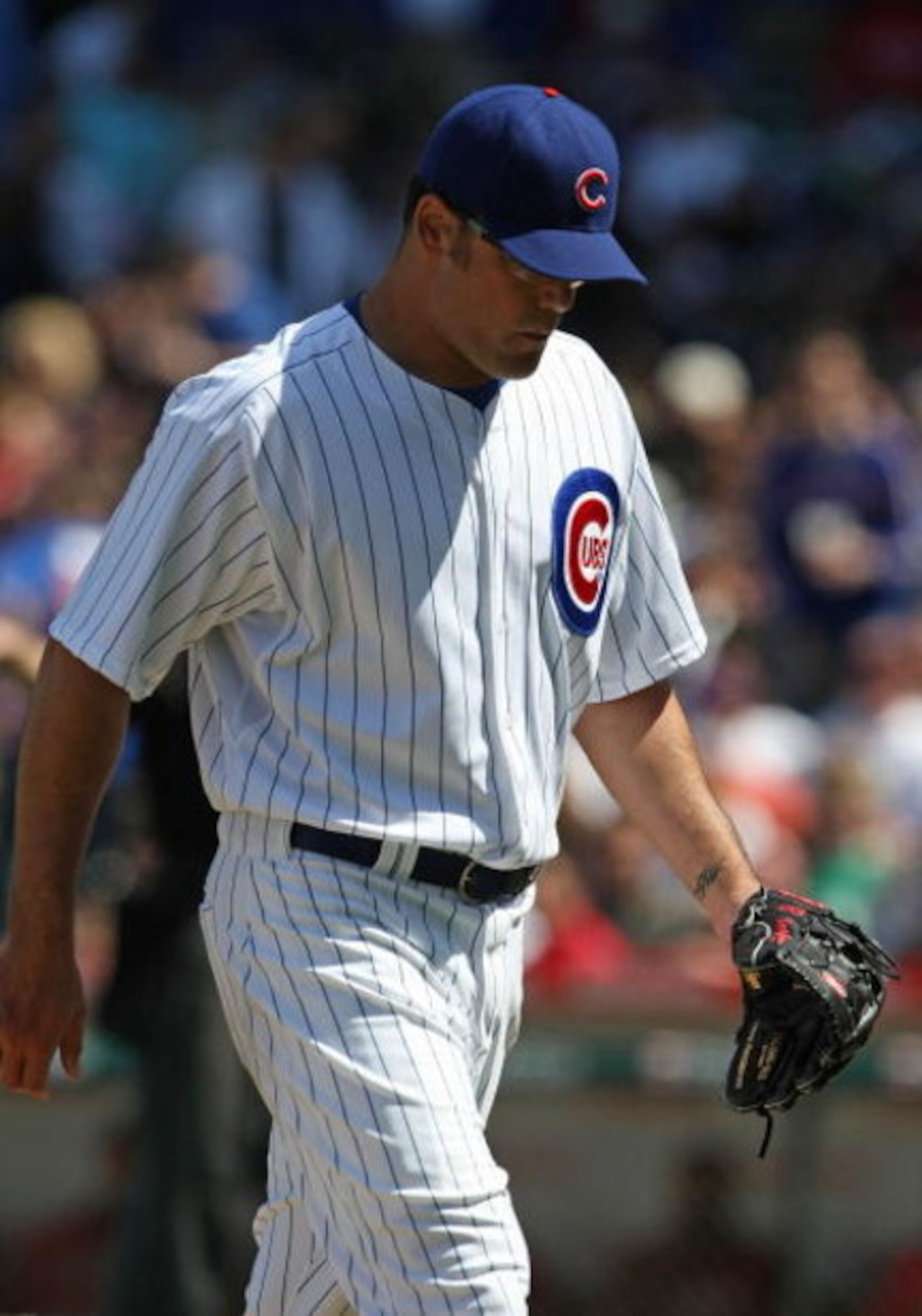 CHICAGO - MAY 16: Kevin Gregg #63 of the Chicago Cubs leaves the field after giving up two home runs, two singles and hitting a Houston Astro batter on May 16, 2009 at Wrigley Field in Chicago, Illinois. The Cubs defeated the Astros 5-4. (Photo by Jonatha
