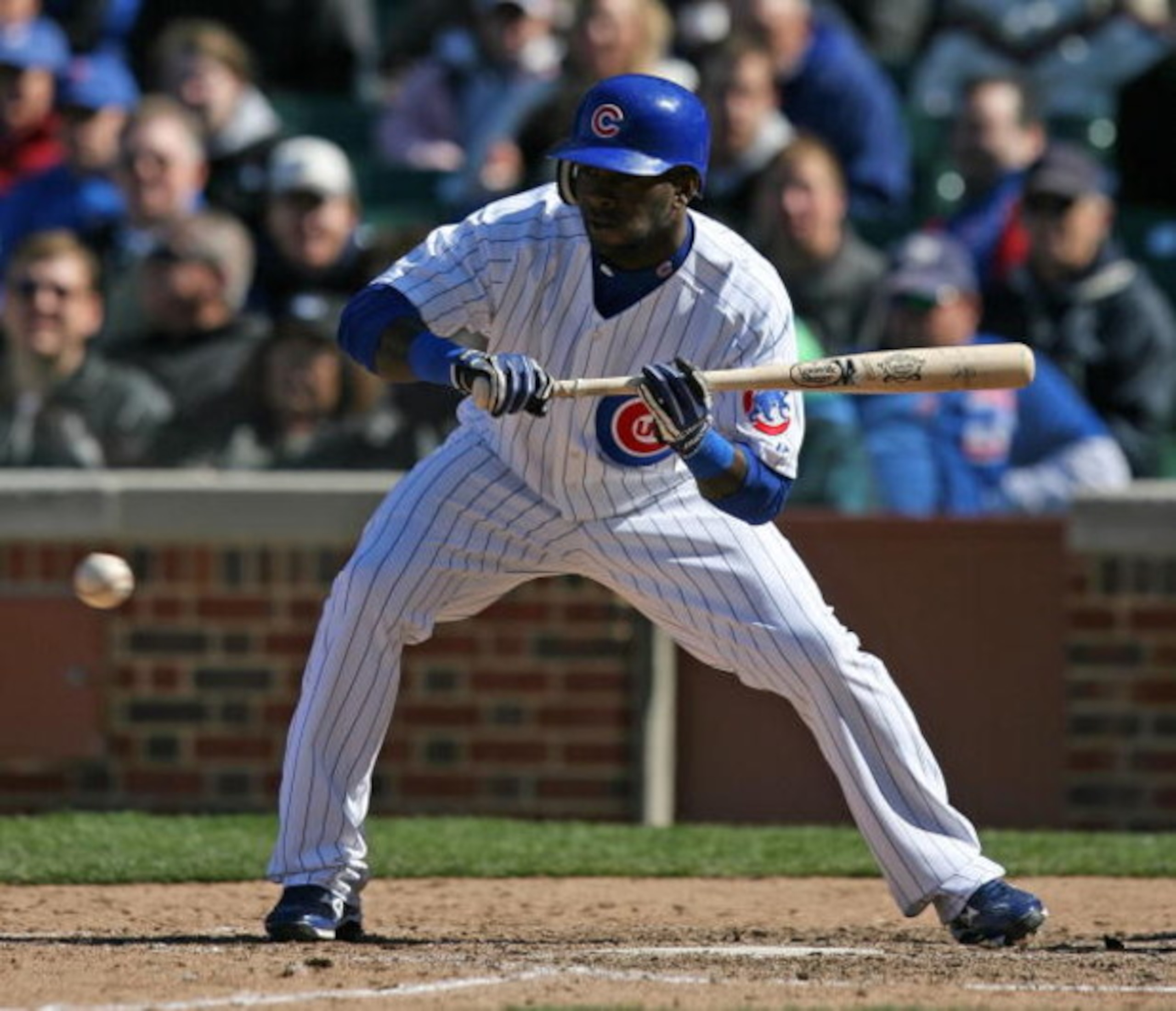 CHICAGO - APRIL 15: Joey Gathright #4 of the Chicago Cubs attempts a bunt against the Colorado Rockies on April 15, 2009 at Wrigley Field in Chicago, Illinois. The Rockies defeated the Cubs 5-2. (Photo by Jonathan Daniel/Getty Images) 