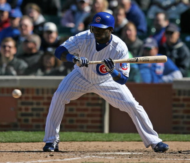 CHICAGO - APRIL 15: Joey Gathright #4 of the Chicago Cubs attempts a bunt against the Colorado Rockies on April 15, 2009 at Wrigley Field in Chicago, Illinois. The Rockies defeated the Cubs 5-2. (Photo by Jonathan Daniel/Getty Images) 