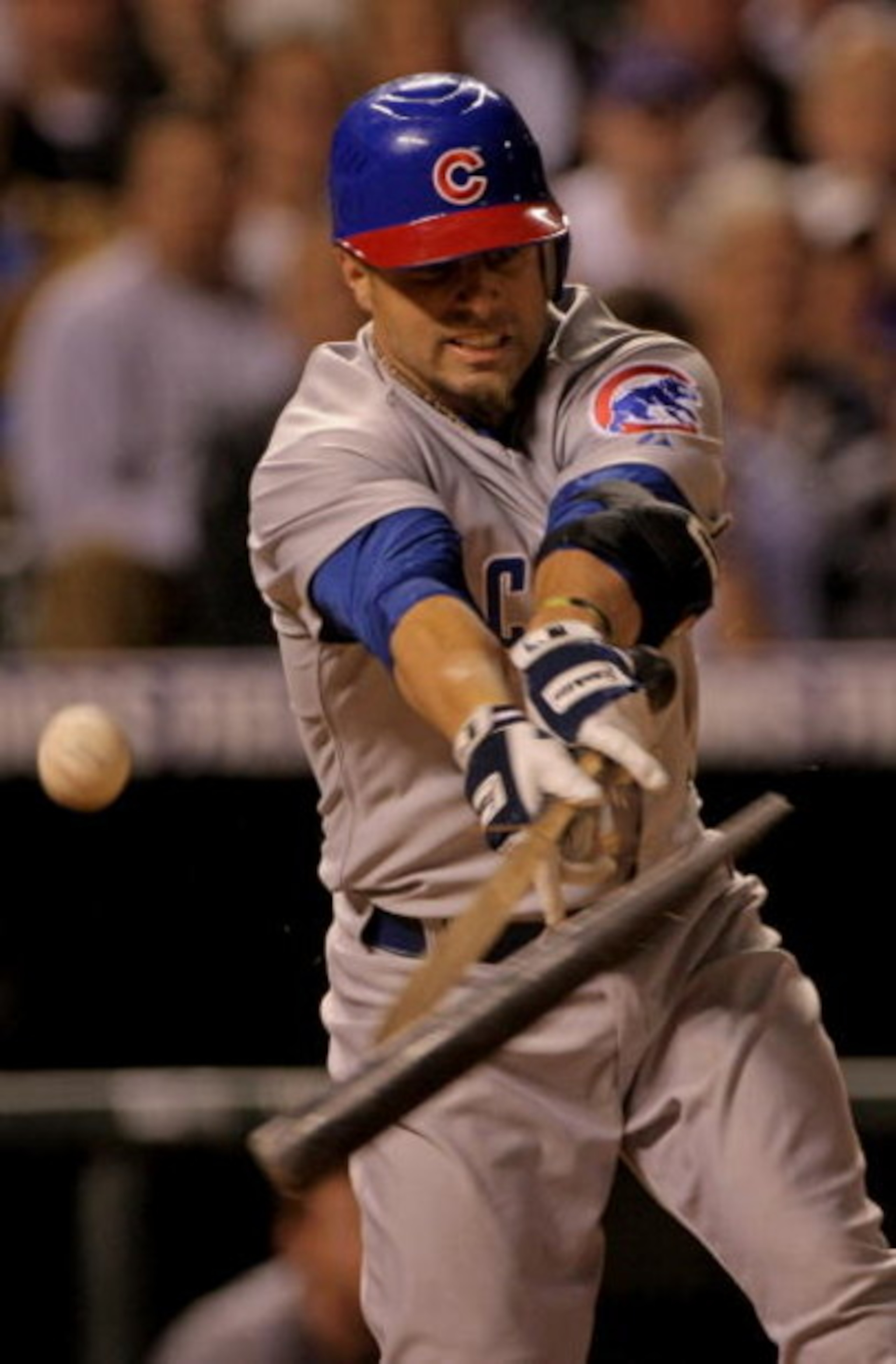 DENVER - APRIL 23:  Reed Johnson #9 of the Chicago Cubs breaks his bat as he fouls off a ball against the Colorado Rockies at Coors Field on April 23, 2008 in Denver, Colorado. The Cubs defeated the Rockies 7-6 in 10 innings to secure the club's 10,000th 