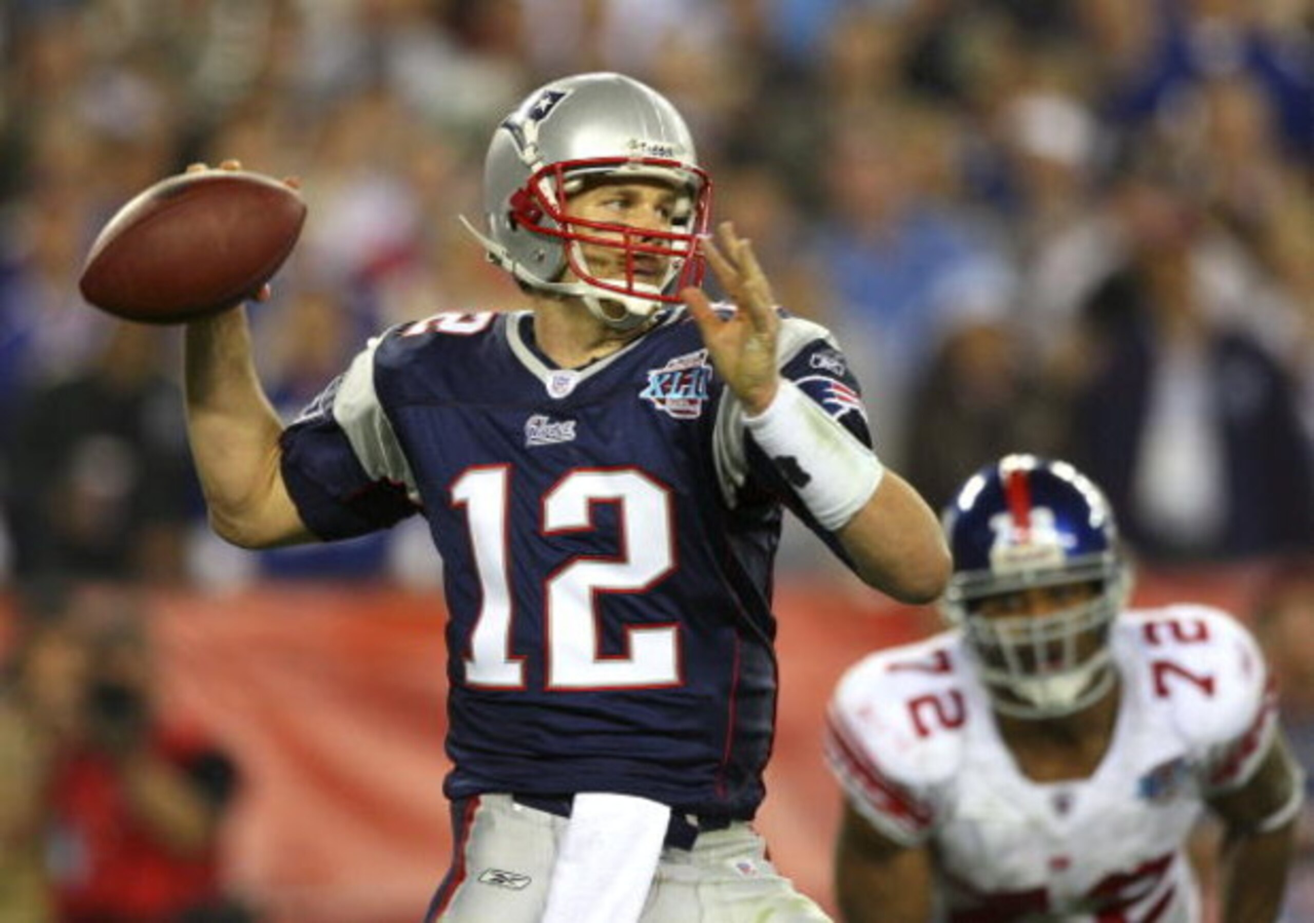 GLENDALE, AZ - FEBRUARY 03:  Quarterback Tom Brady #12 of the New England Patriots drops back to pass against the New York Giants the second half of Super Bowl XLII on February 3, 2008 at the University of Phoenix Stadium in Glendale, Arizona. The Giants 