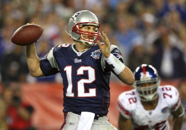 GLENDALE, AZ - FEBRUARY 03:  Quarterback Tom Brady #12 of the New England Patriots drops back to pass against the New York Giants the second half of Super Bowl XLII on February 3, 2008 at the University of Phoenix Stadium in Glendale, Arizona. The Giants 
