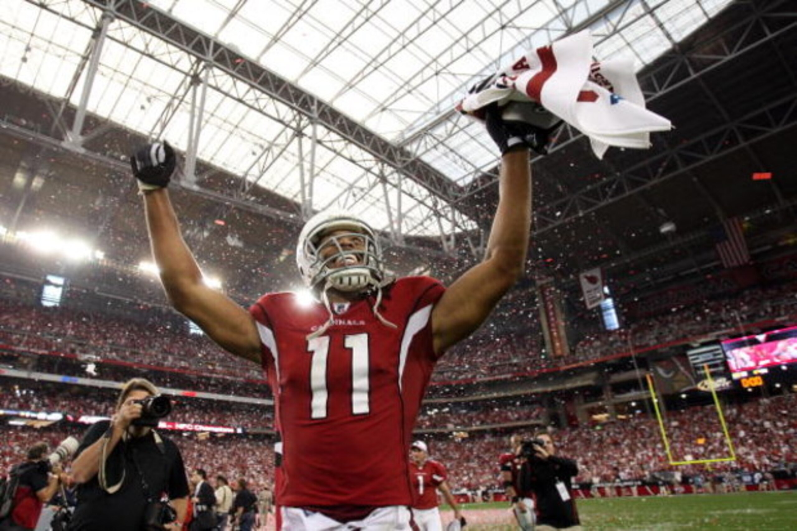 GLENDALE, AZ - JANUARY 18:  Wide receiver Larry Fitzgerald #11 of the Arizona Cardinals celebrates after winning the NFC championship game against the Philadelphia Eagles on January 18, 2009 at University of Phoenix Stadium in Glendale, Arizona. The Cardi