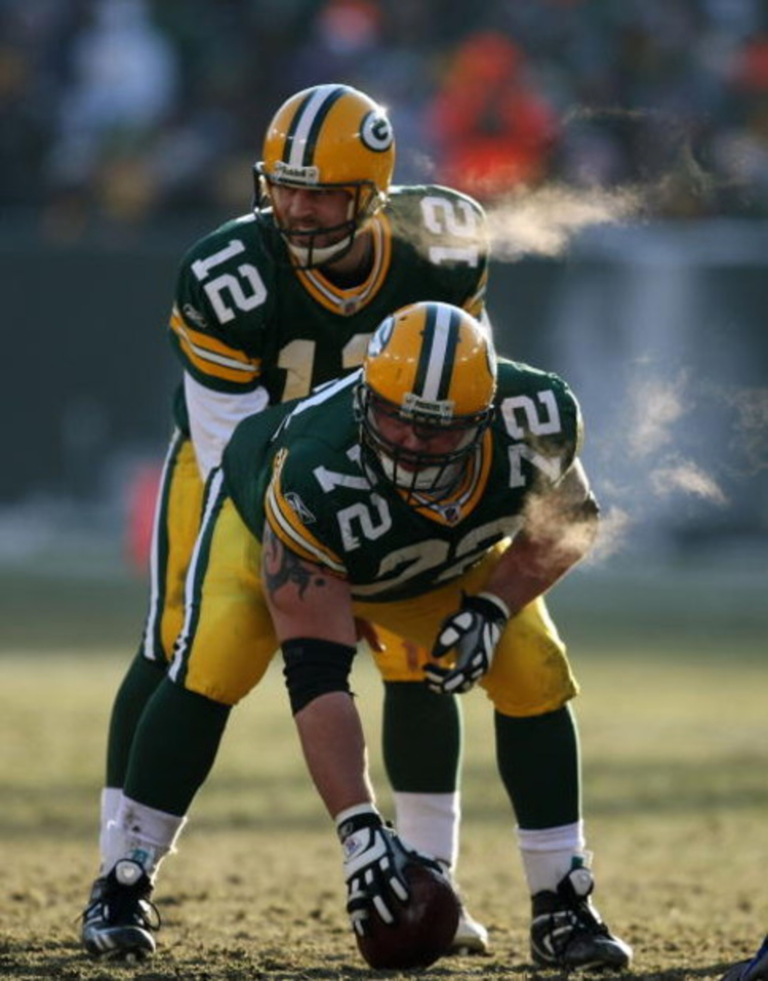 GREEN BAY, WI - DECEMBER 28: Aaron Rodgers #12 of the Green Bay Packers awaits the snap from George Foster #72 during a game against the Detroit Lions on December 28, 2008 at Lambeau Field in Green Bay, Wisconsin. The Packers defeated the Lions 31-21.  (P
