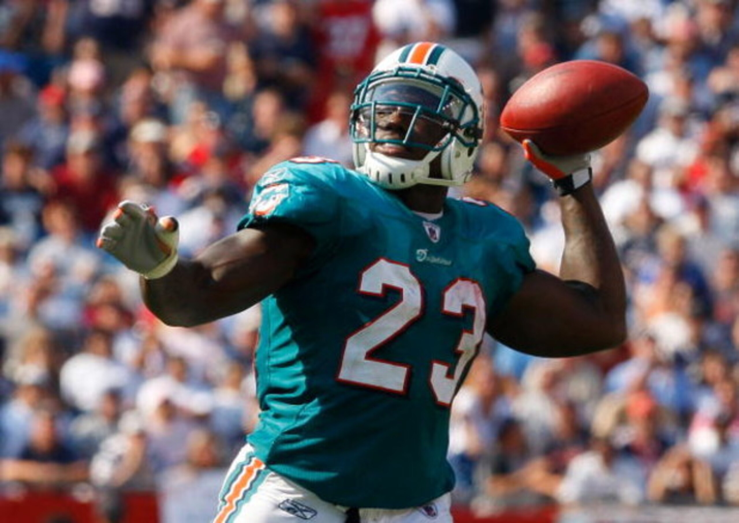 FOXBORO, MA - SEPTEMBER 21: Ronnie Brown #23 of he Miami Dolphins throws a touchdown pass in the third quarter against the New England Patriots at Gillette Stadium on September 21, 2008 in Foxboro, Massachusetts. (Photo by Jim Rogash/Getty Images)
