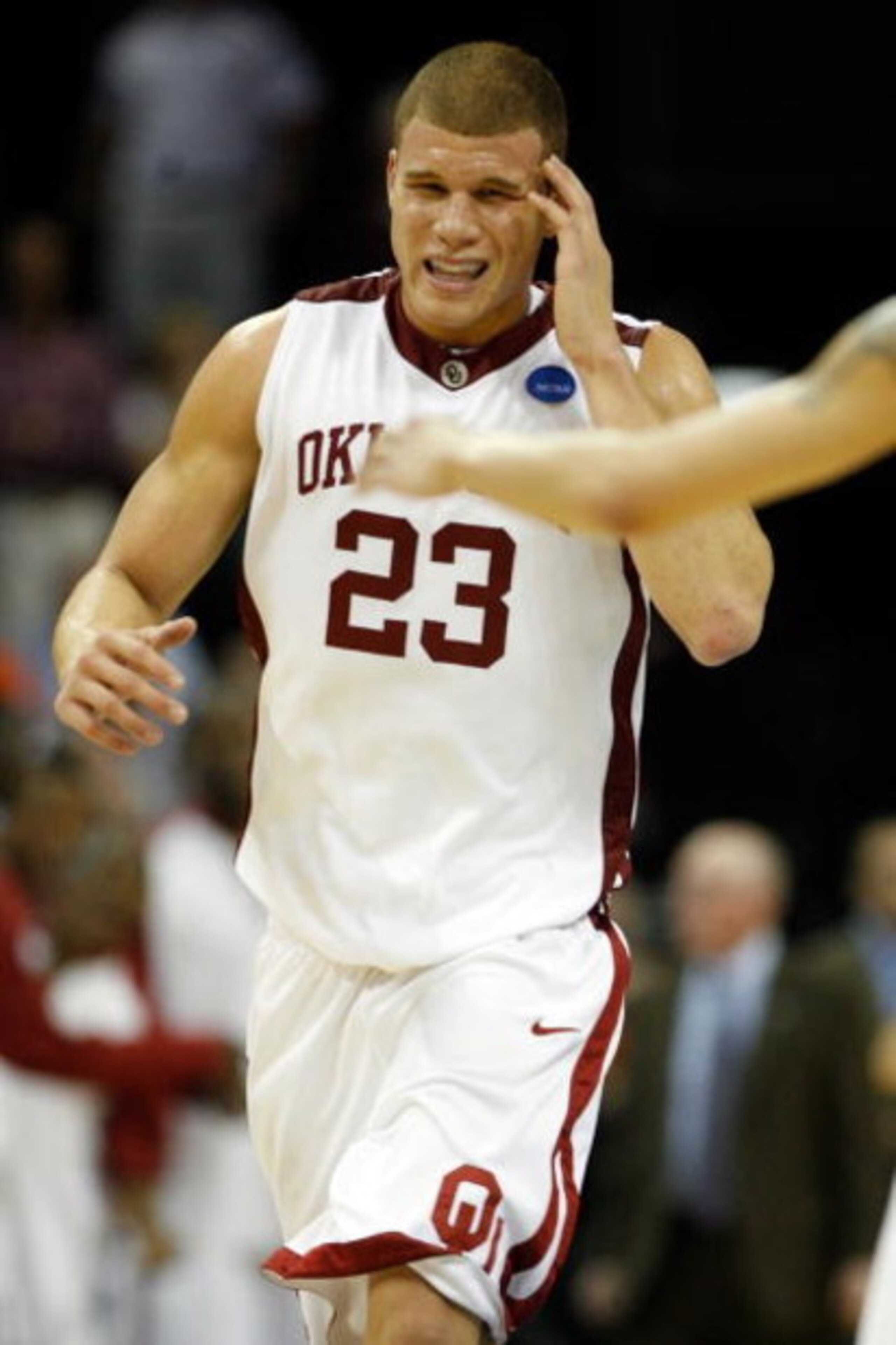 MEMPHIS, TN - MARCH 27:  Blake Griffin #23 of the Oklahoma Sooners holds his head after he hits his head on the side on the backboard in the second half while dunking the ball against the Syracuse Orange during the NCAA Men's Basketball Tournament South R
