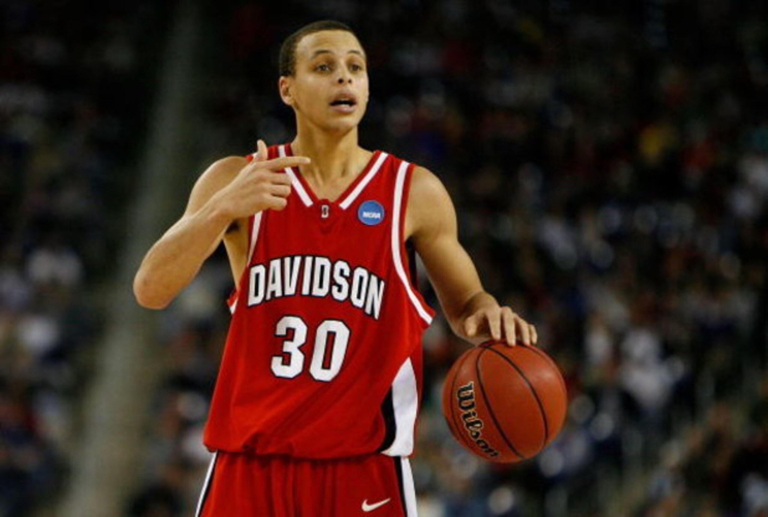 DETROIT - MARCH 30:  Stephen Curry #30 of the Davidson Wildcats directs the offense against the Kansas Jayhawks during the Midwest Regional Final of the 2008 NCAA Division I Men's Basketball Tournament at Ford Field on March 30, 2008 in Detroit, Michigan.
