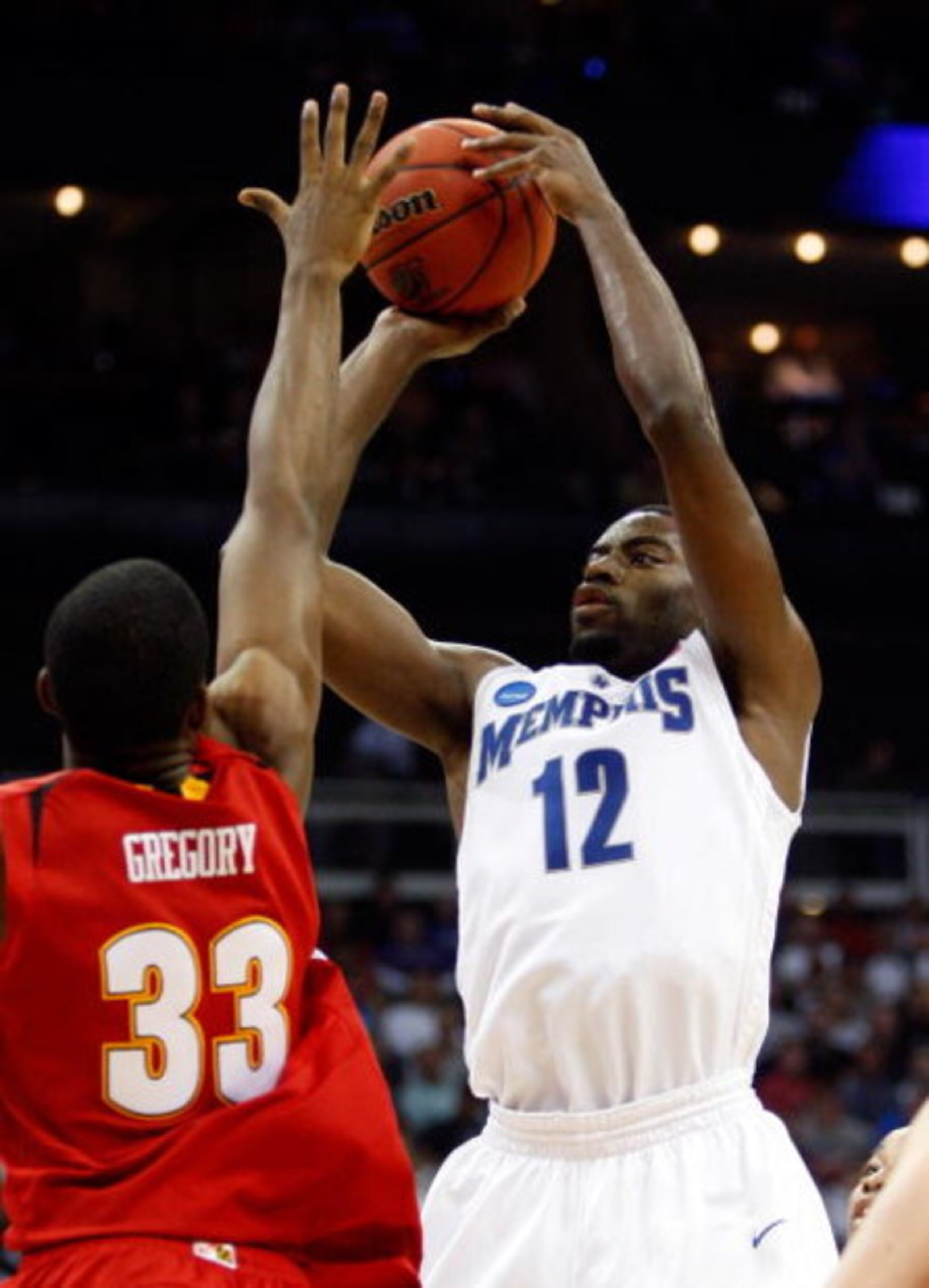 KANSAS CITY, MO - MARCH 21:  Tyreke Evans #12 of the Memphis Tigers sets up for a shot attempt during their second round game against the Maryland Terrapins in the NCAA Division I Men's Basketball Tournament at the Sprint Center on March 21, 2009 in Kansa