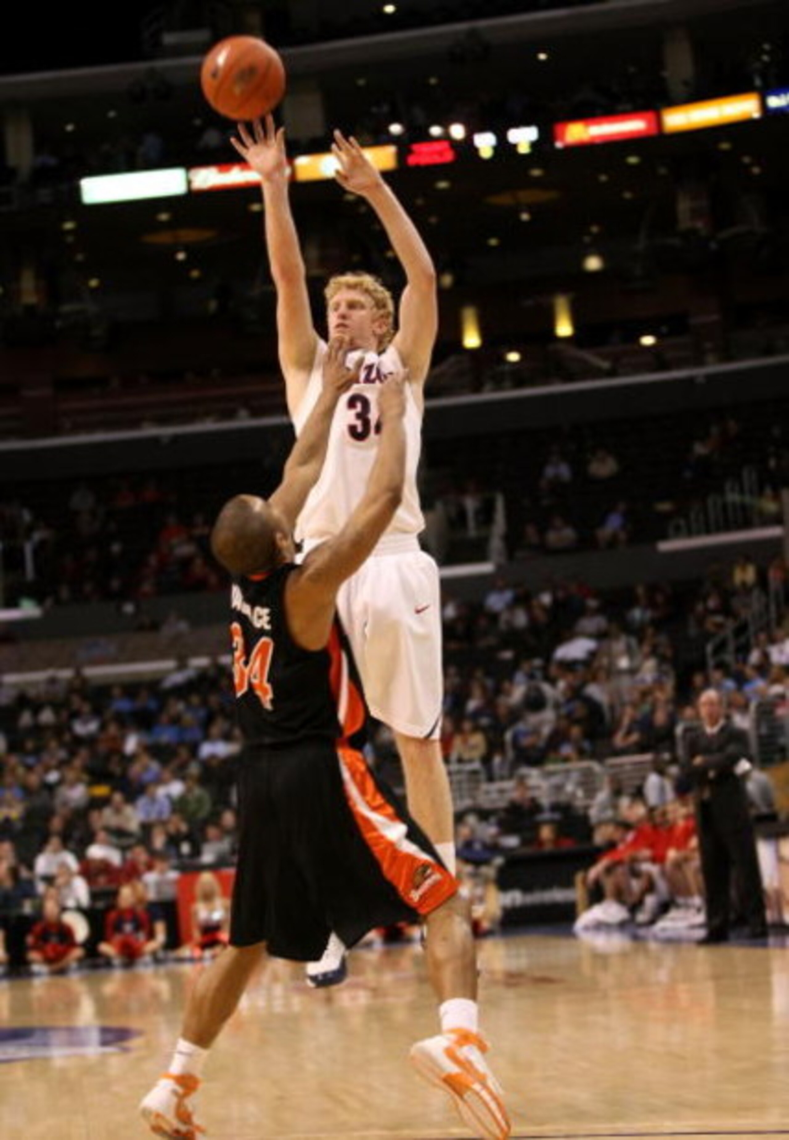 LOS ANGELES, CA - MARCH 12:  Chase Budinger #34 of the Arizona Wildcats shoots over the defense of Lathen Wallace #34 of the Oregon State Beavers during the 2008 Pacific Life Pac-10 Men's Basketball Tournament Day One at Staples Center on March 12, 2008 i
