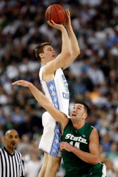 DETROIT - APRIL 06: Tyler Hansbrough #50 of the North Carolina Tar Heels goes up for a shot over Goran Suton #14 of the Michigan State Spartans in the first half during the 2009 NCAA Division I Men's Basketball National Championship game at Ford Field on DETROIT - APRIL 06: Tyler Hansbrough #50 of the North Carolina Tar Heels goes up for a shot over Goran Suton #14 of the Michigan State Spartans in the first half during the 2009 NCAA Division I Men's Basketball National Championship game at Ford Field on