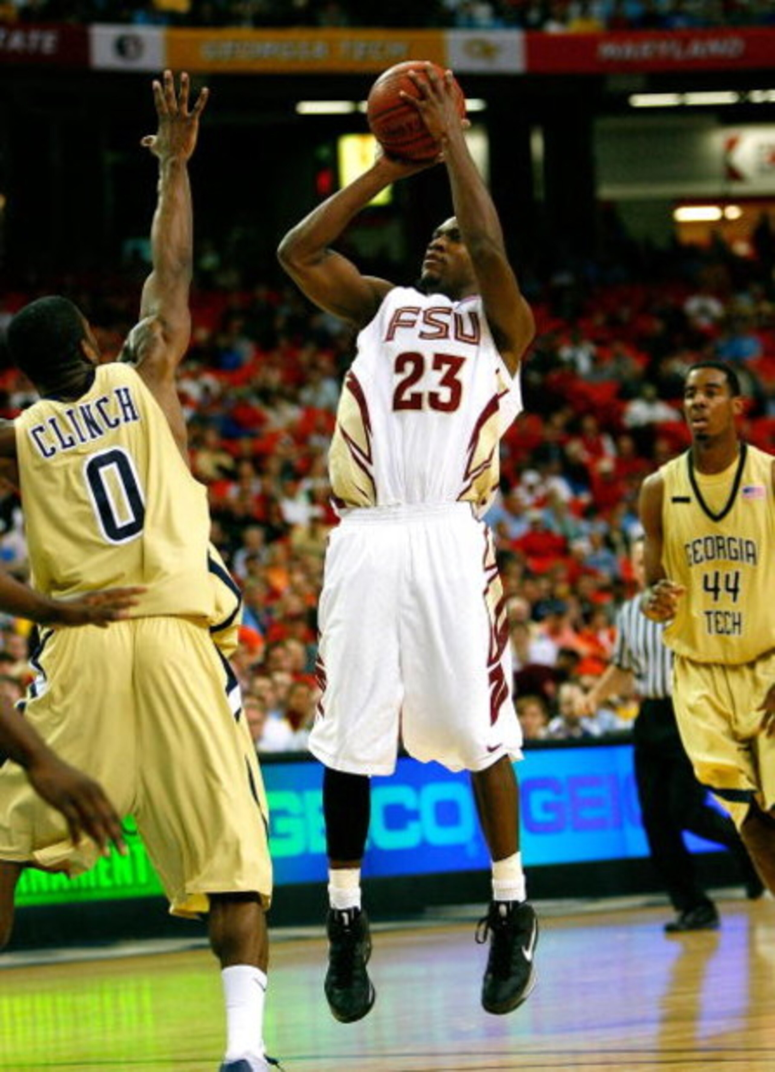 ATLANTA - MARCH 13:  Toney Douglas #23 of the Florida State Seminoles shoots against Lewis Clinch #0 of the Georgia Tech Yellow Jackets during day two of the 2009 ACC Men's Basketball Tournament on March 13, 2009 at the Georgia Dome in Atlanta, Georgia.  