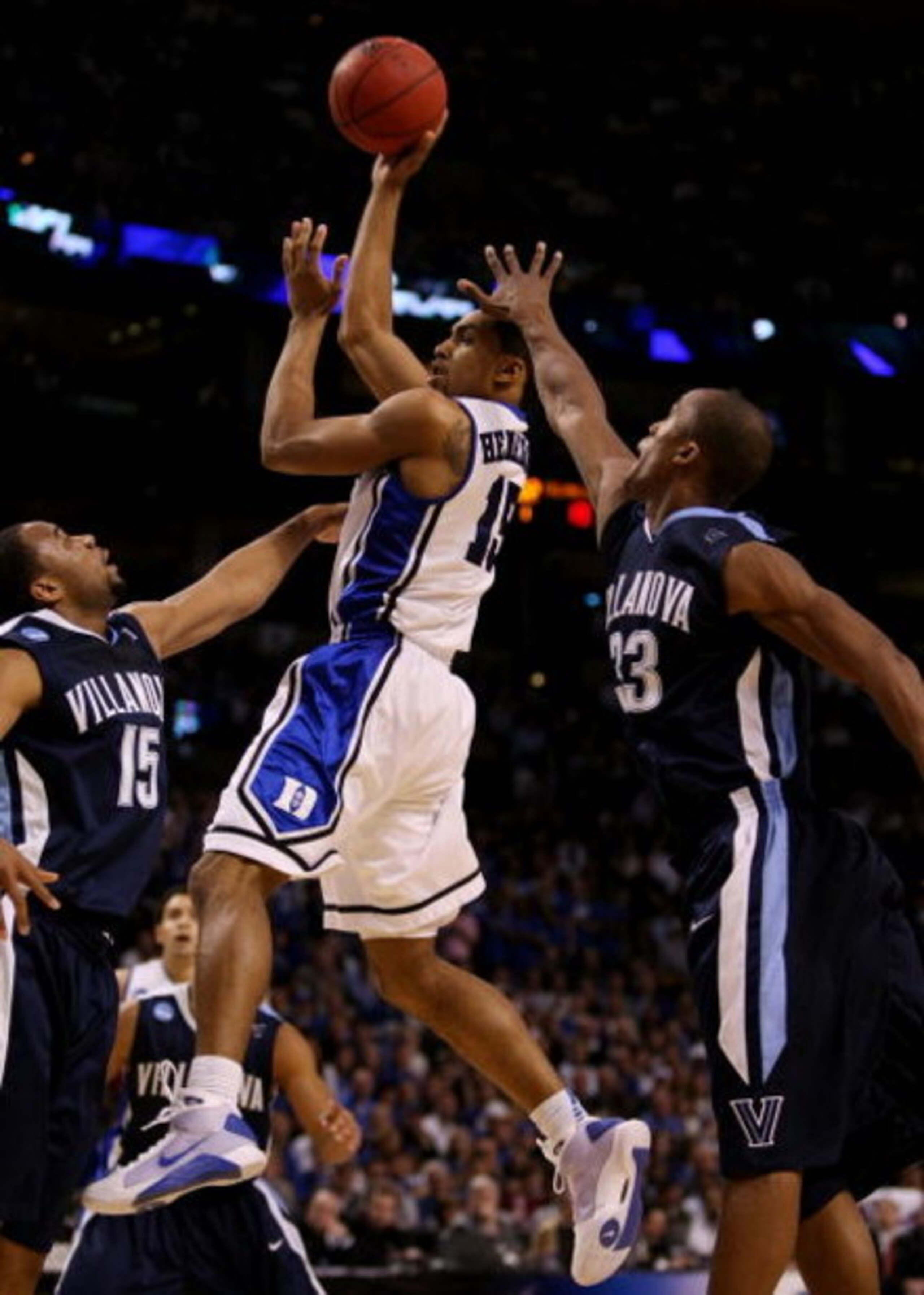 BOSTON - MARCH 26:  Gerald Henderson #15 of the Duke Blue Devils puts up a shot over Reggie Redding #15 and Dante Cunningham #33 of the Villanova Wildcats during the NCAA Men's Basketball Tournament East Regionals at TD Banknorth Garden on March 26, 2009 