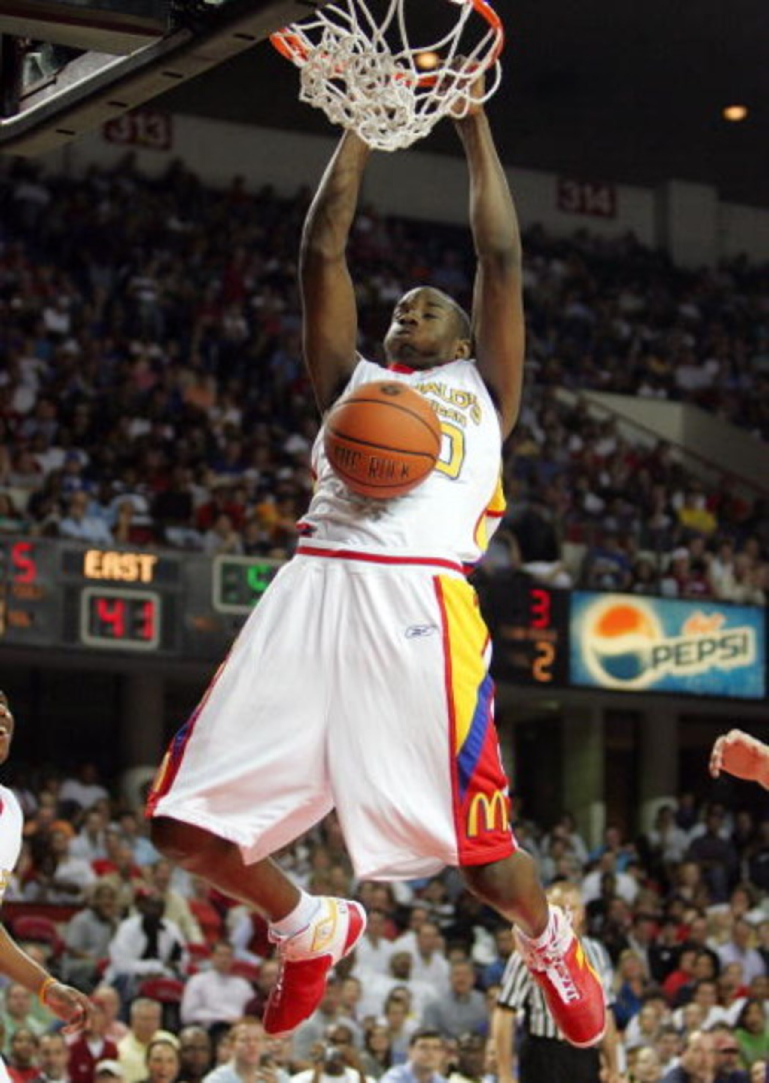 LOUISVILLE, KY - MARCH 28:  Gani Lawal #30 of the East Team dunks the ball during the boys game at the McDonald's All American High School Basketball Games on March 28, 2007 at Freedom Hall in Louisville, Kentucky.  (Photo by Andy Lyons/Getty Images)