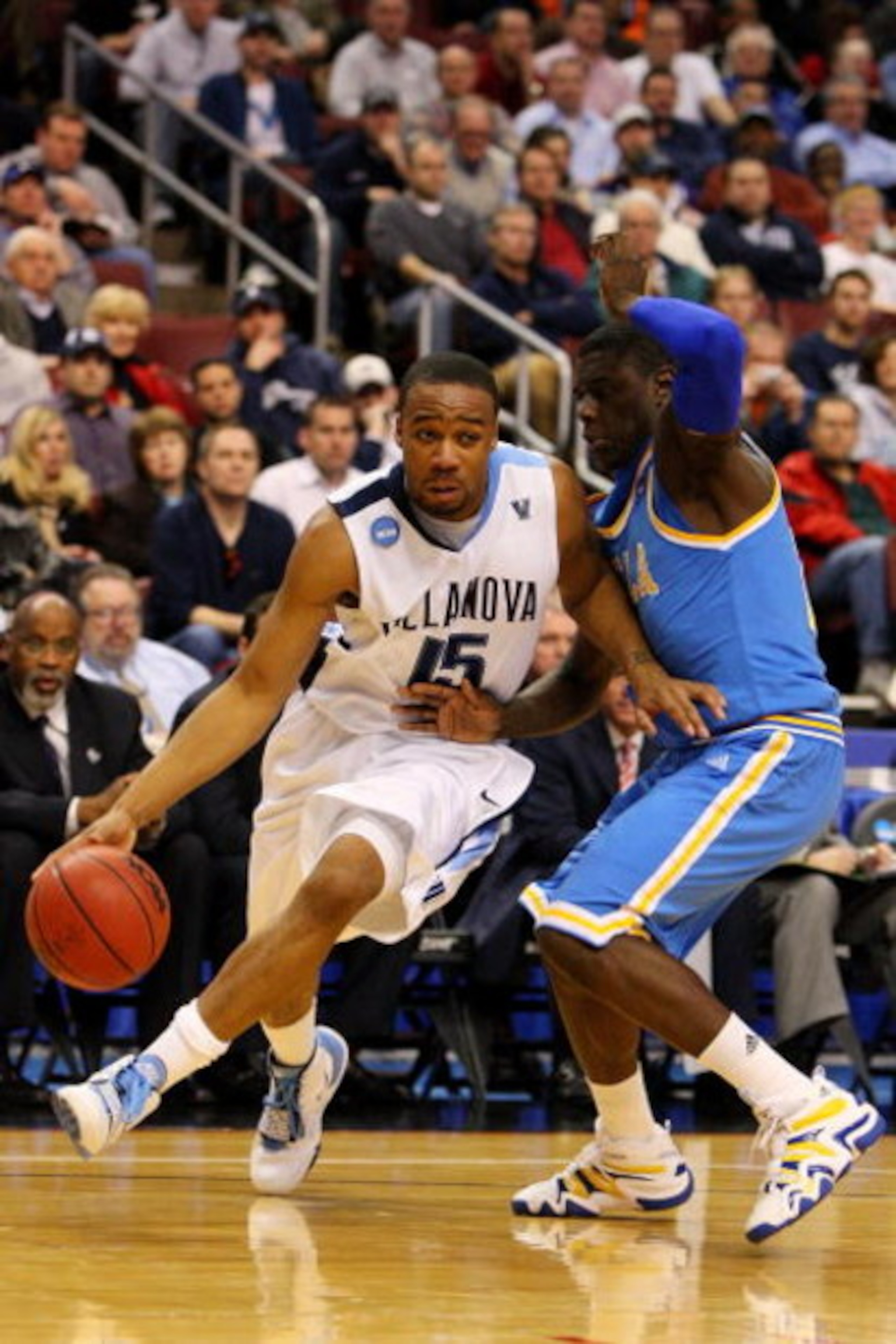 PHILADELPHIA - MARCH 21:  Reggie Redding #15 of the Villanova Wildcats drives against Jrue Holiday #21 of the UCLA Bruins during the second round of the NCAA Division I Men's Basketball Tournament at the Wachovia Center on March 21, 2009 in Philadelphia, 