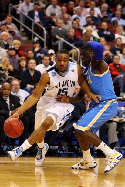 PHILADELPHIA - MARCH 21:  Reggie Redding #15 of the Villanova Wildcats drives against Jrue Holiday #21 of the UCLA Bruins during the second round of the NCAA Division I Men's Basketball Tournament at the Wachovia Center on March 21, 2009 in Philadelphia, 
