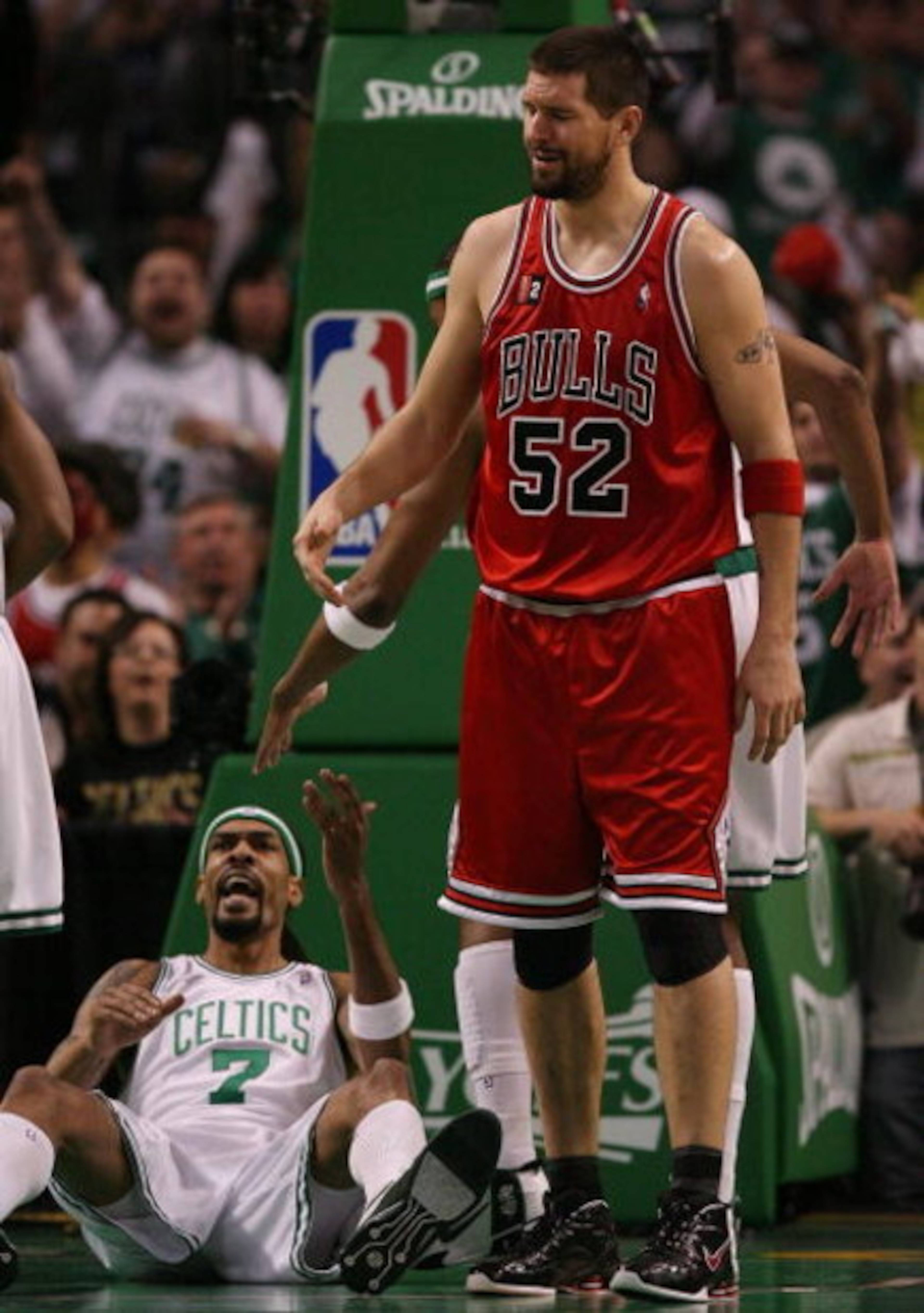 BOSTON - MAY 02:  Brad Miller #52 of the Chicago Bulls reacts after he is called for a foul as Mikki Moore #7 of the Boston Celtics celebrates in Game Seven of the Eastern Conference Quarterfinals during the 2009 NBA Playoffs at TD Banknorth Garden on May