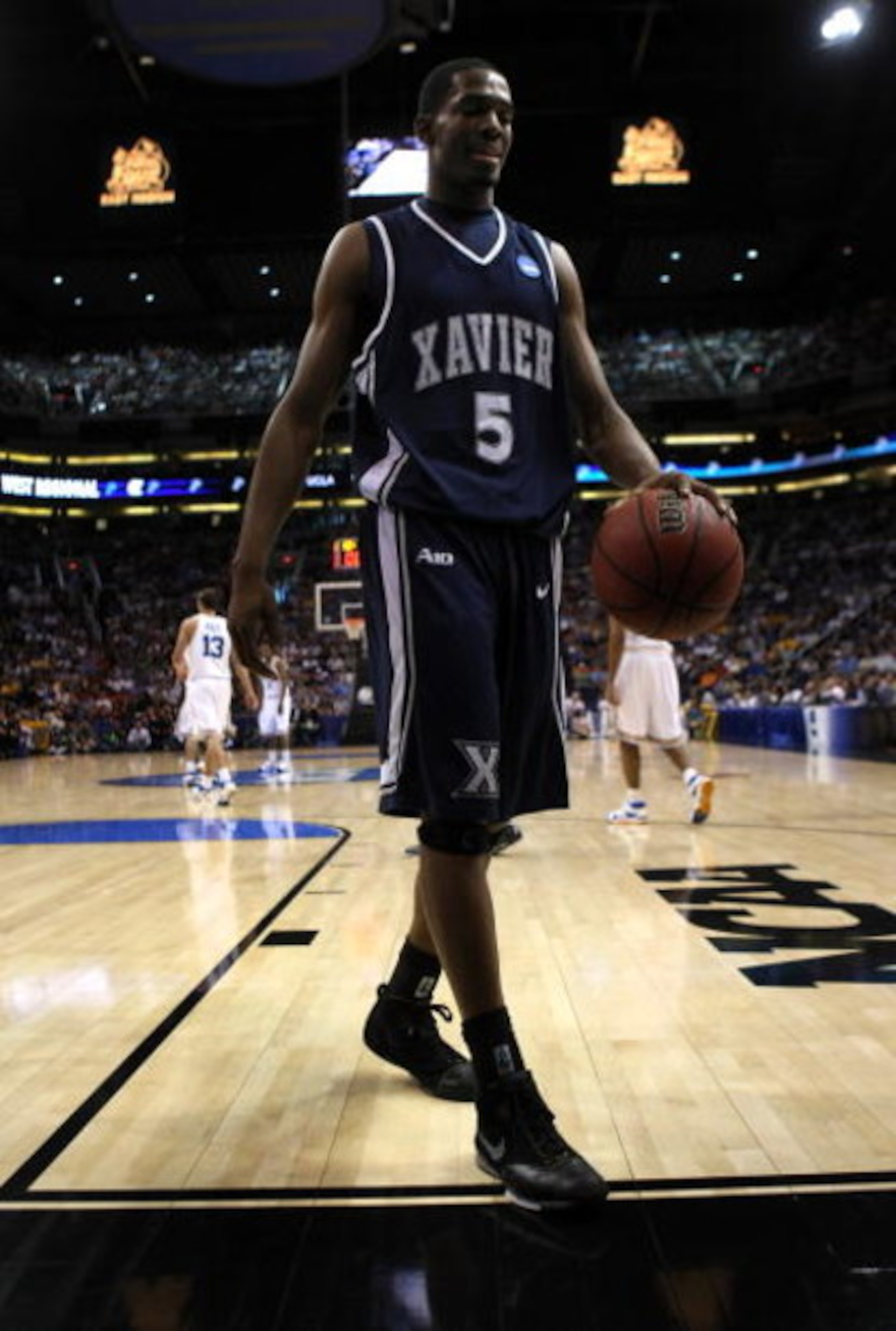 PHOENIX - MARCH 29:  Derrick Brown #5 of the Xavier Musketeers walks on the court against the UCLA Bruins during the first half of the West Regional Final at the U.S. Airways Center on March 29, 2008 in Phoenix, Arizona.  (Photo by Stephen Dunn/Getty Imag