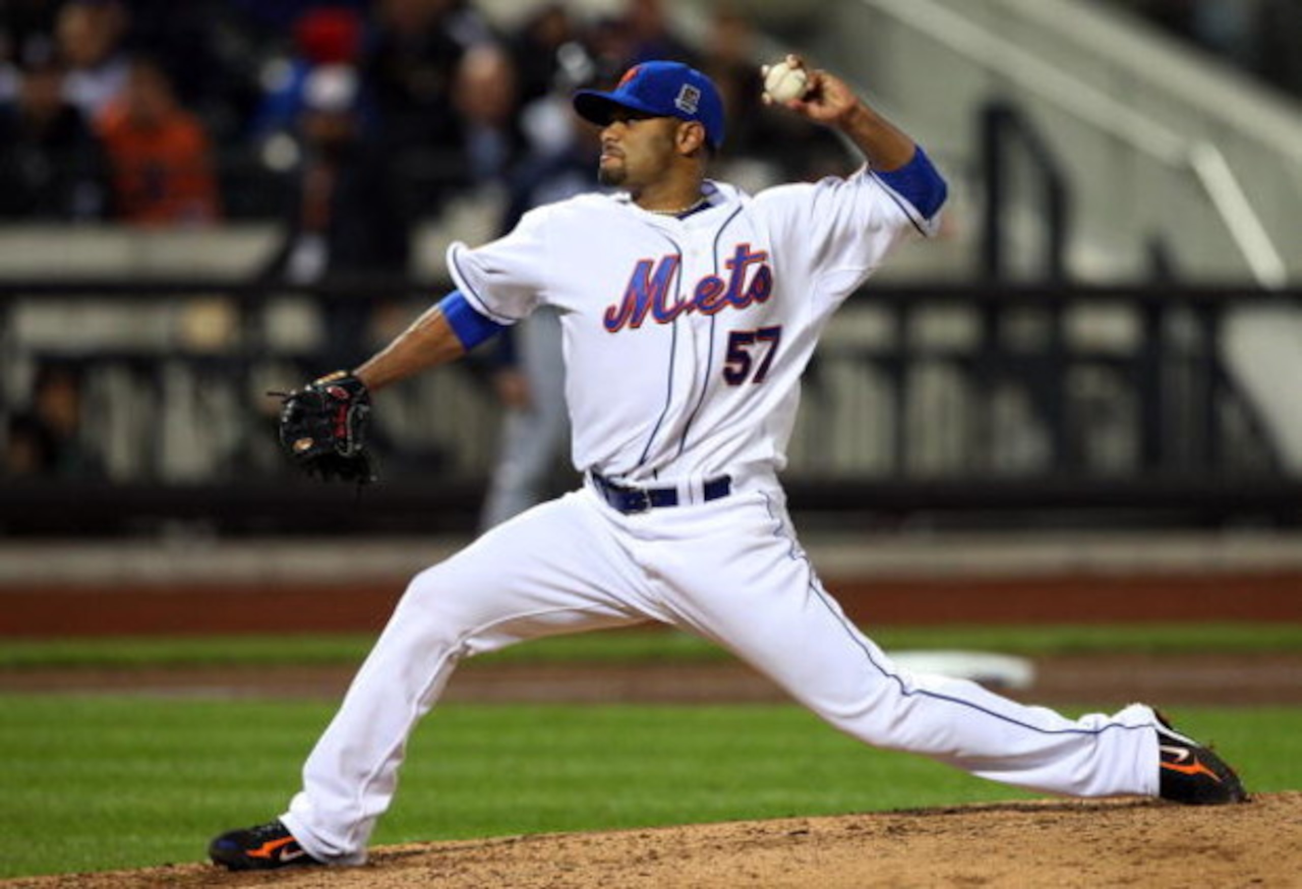 NEW YORK - MAY 11:  Johan Santana #57 of the New York Mets pitches against the Atlanta Braves on May 11, 2009 at Citi Field in the Flushing neighborhood of the Queens borough of New York City. The Braves defeated the Mets 8-3.  (Photo by Jim McIsaac/Getty