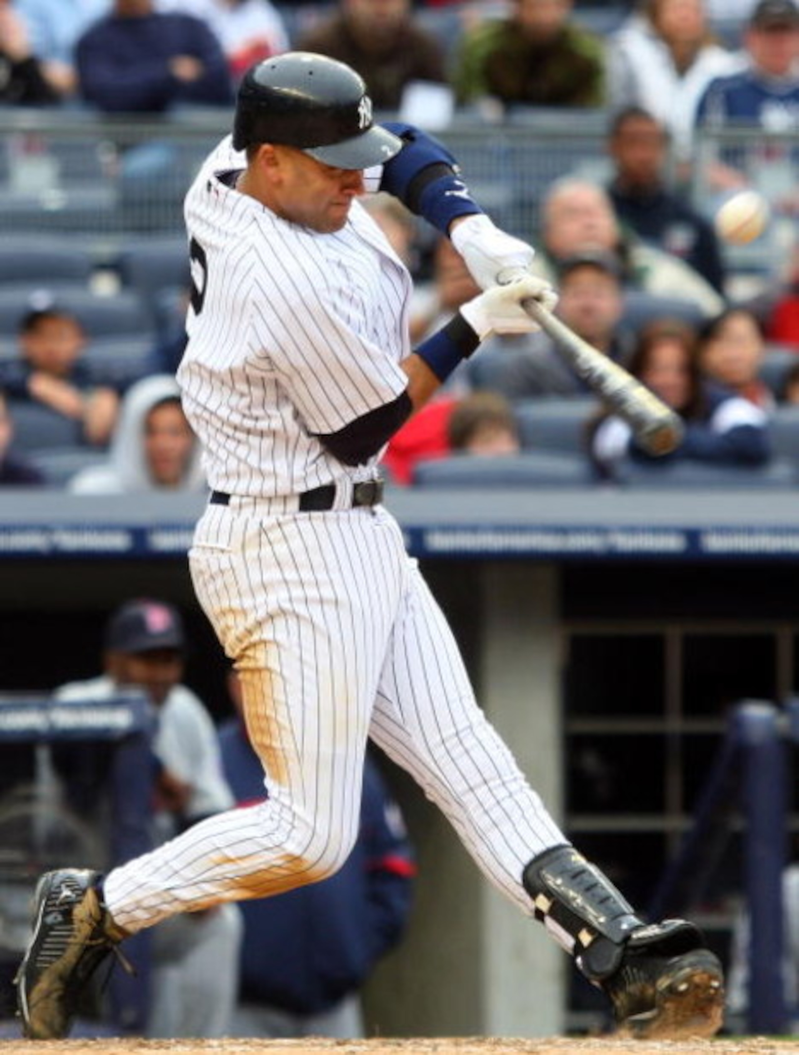 NEW YORK - MAY 17:  Derek Jeter #2 of the New York Yankees connects for an eighth inning base hit against the Minnesota Twins on May 17, 2009 at Yankee Stadium in the Bronx borough of New York City.  (Photo by Jim McIsaac/Getty Images)