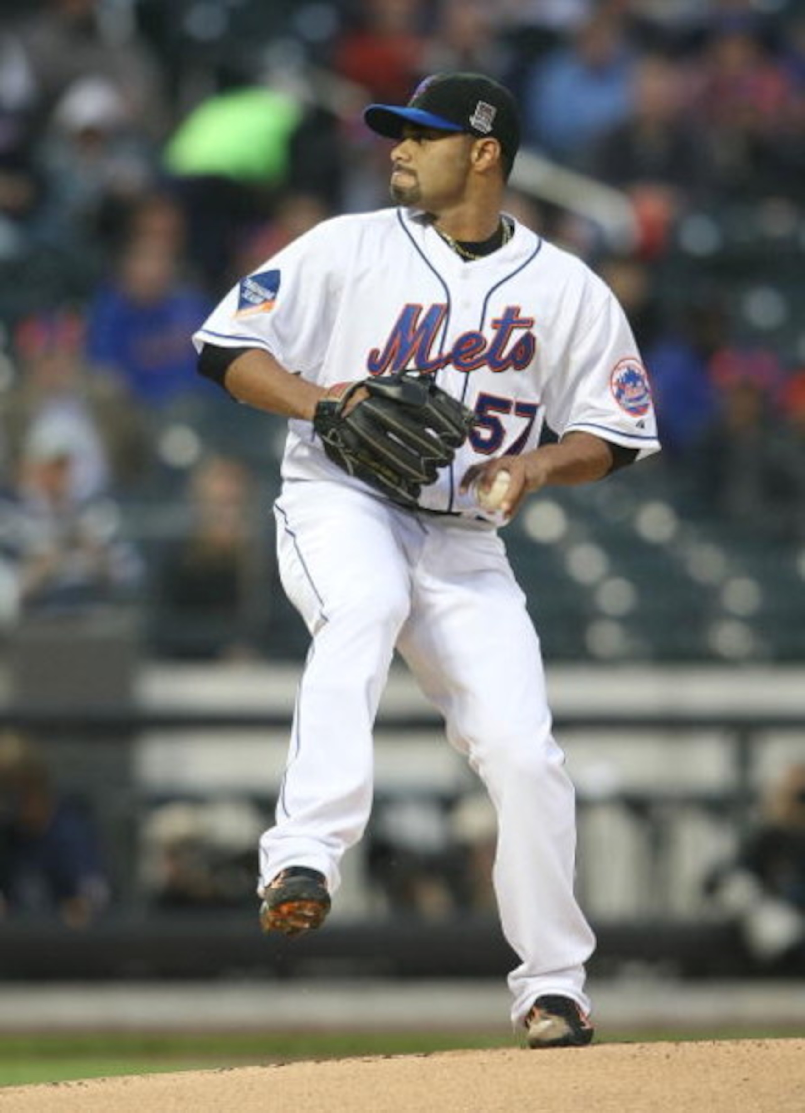 NEW YORK - MAY 06:  Johan Santana  #57 of the New York Mets pitches against the Philadelphia Phillies at Citi Field on May 6, 2009 in the Flushing neighborhood of the Queens borough of New York City.  (Photo by Nick Laham/Getty Images)