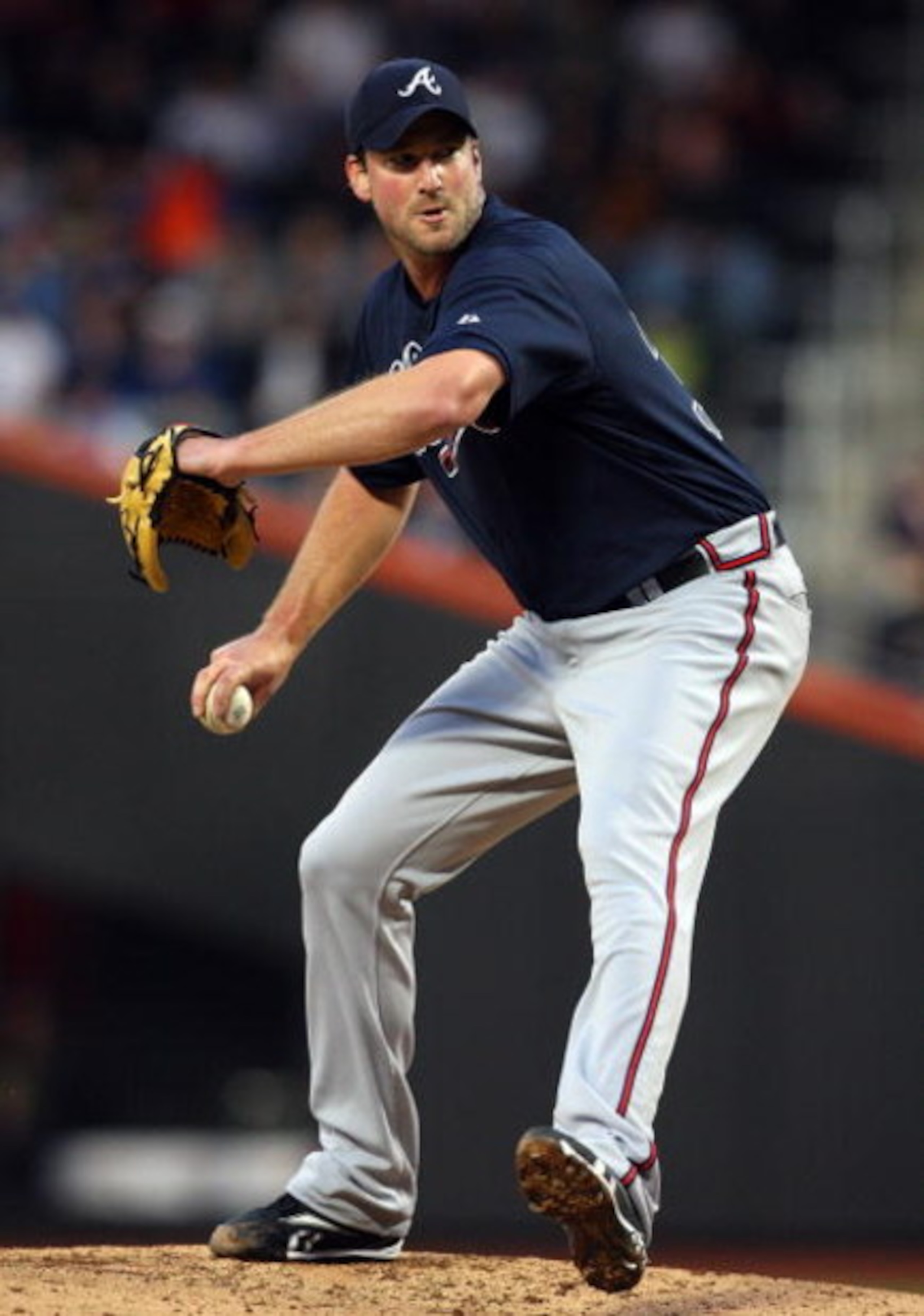 NEW YORK - MAY 11:  Derek Lowe #32 of the Atlanta Braves throws a pitch against the New York Mets on May 11, 2009 at Citi Field in the Flushing neighborhood of the Queens borough of New York City. The Braves defeated the Mets 8-3.  (Photo by Jim McIsaac/G