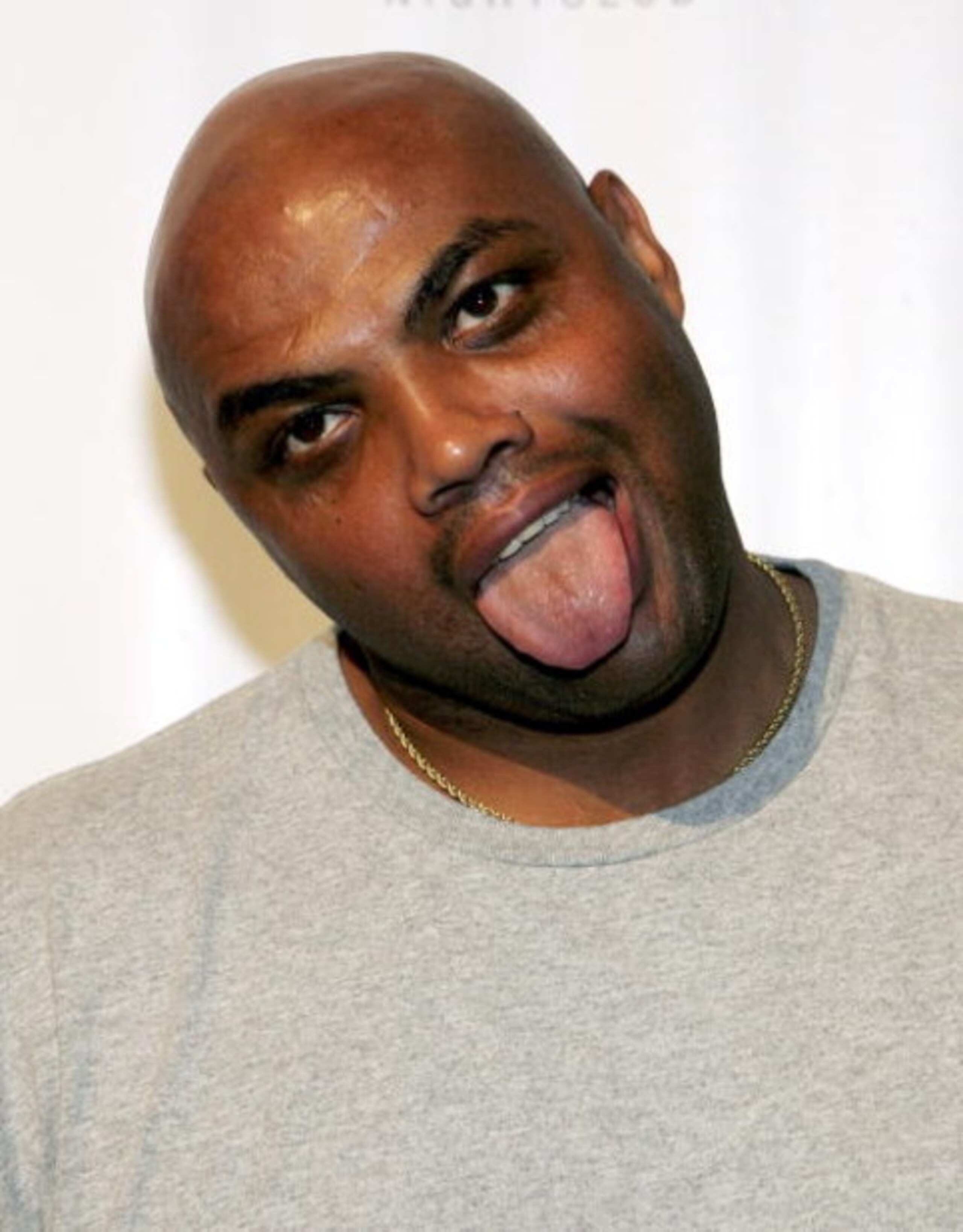LAS VEGAS - JULY 9: TNT NBA analyst and former NBA player Charles Barkley jokes around as he arrives at the celebrity basketball 'New School vs. Old School' poker tournament at the Mirage July 9, 2005 in Las Vegas, Nevada. The event was held to benefit Op