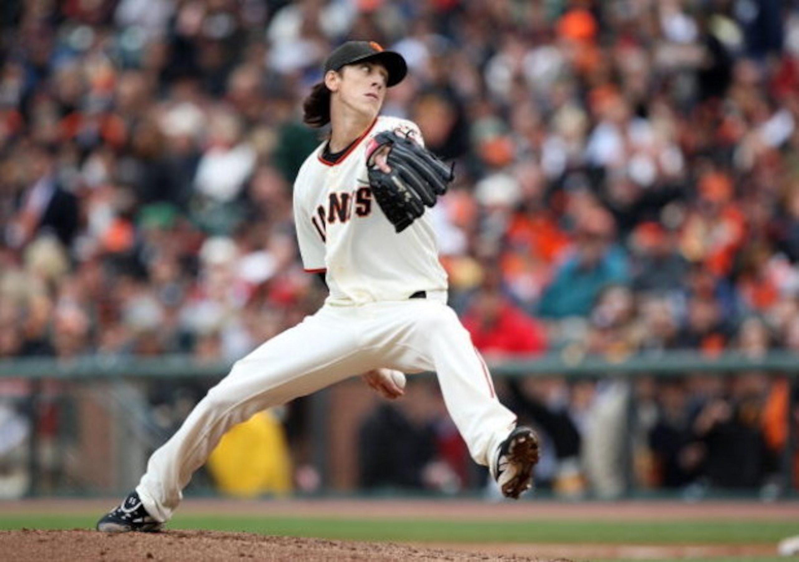 SAN FRANCISCO - APRIL 07:  Tim Lincecum #55 of the San Francisco Giants pitches against the Milwaukee Brewers during Opening Day of the Major League Baseball season on April 7, 2009 at AT&T Park in San Francisco, California.  (Photo by Jed Jacobsohn/Getty