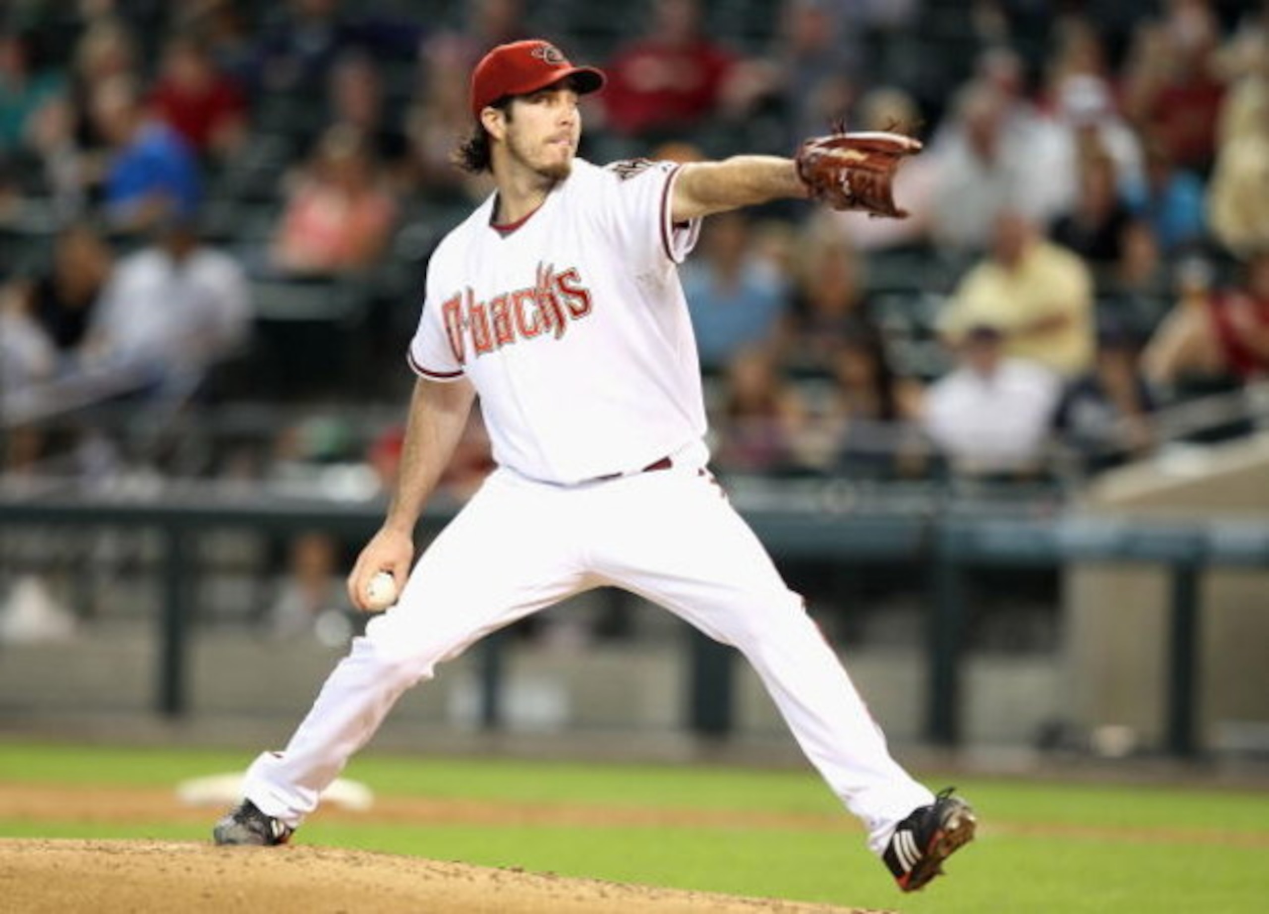 PHOENIX - APRIL 22:  Starting pitcher Dan Haren #15 of the Arizona Diamondbacks pitches against the Colorado Rockies during the game at Chase Field on April 22, 2009 in Phoenix, Arizona. The Diamondbacks defeated the Rockies 2-0.  (Photo by Christian Pete